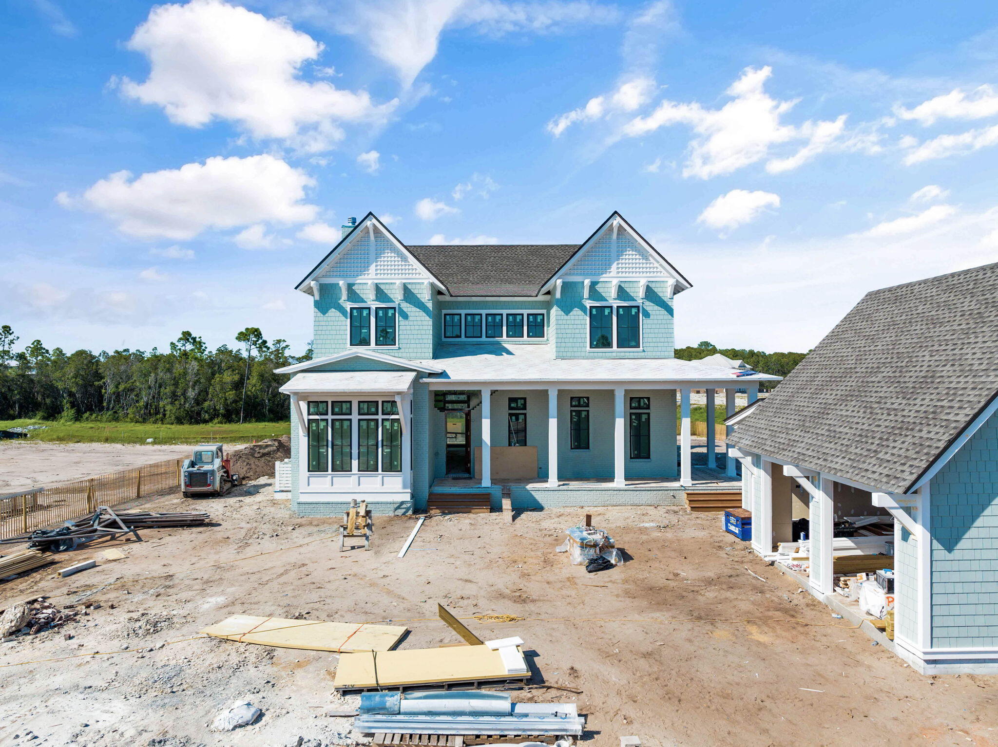 Prominently positioned behind the private gates of Camp Creek, 410 Golfridge Drive presents a compelling new construction opportunity nearing completion. Configured by the talented team at Allison Ramsey Architects, the thoughtfully designed floorplan encompasses over 3,300 square feet of living space spanning two distinct levels. Upon initial approach, the welcoming covered porch leads way to the entry foyer and main living areas. Meticulously crafted to offer a perfect blend of contemporary design, comfort, and functionality, the living, dining, and kitchen areas are seamlessly connected and ready for entertaining.