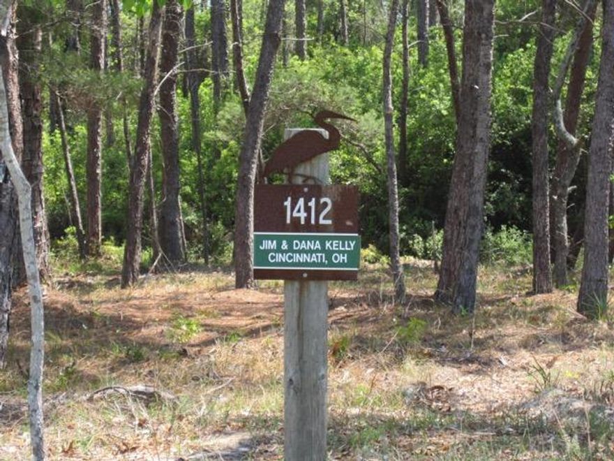 Seller is extremely motivated! This is a nice, large, ''B'' lot with .39 of an acre. Please compare to other lots available in Wild Heron. Lot backs up to a wooded area on hole #6. Wild Heron is a gated community loaded with amenities which include a fitness center with views of Lake Powell, large community pool, hot tub, dock, canoes and kayaks, boathouse with covered deck area for parties and a stone fireplace, an elevated viewing platform of Lake Powell, fire pit.... the list goes on. One of the nicest features of this community is the miles and miles of roads and walkways for walking and bike riding. Let's not forget Sharks tooth, possibly the finest Golf course on the Emerald Coast.