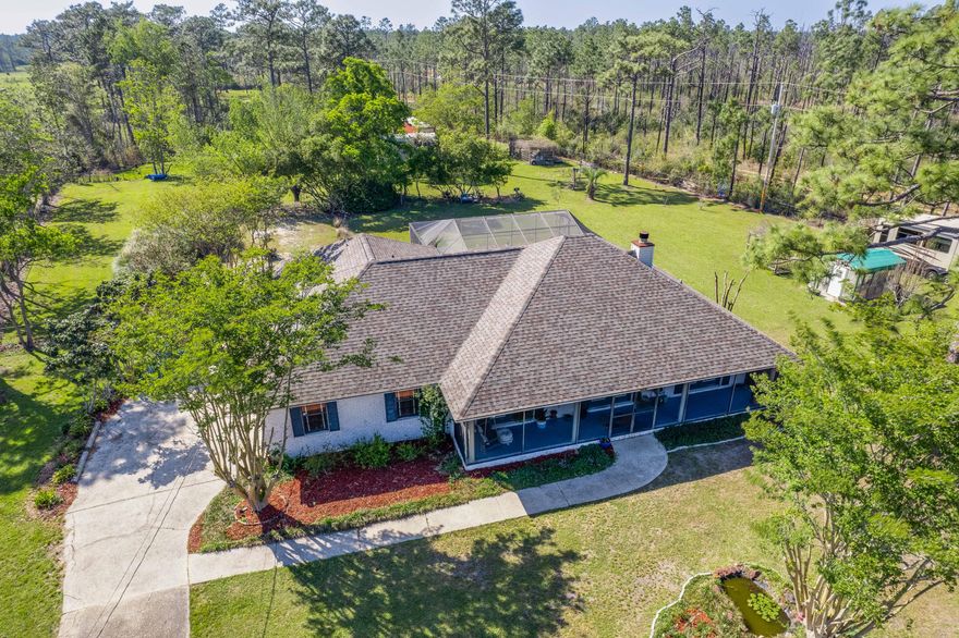 Conveniently located just over 1 mile to access to I-10, this home offers an immaculate, bright, and neutral interior. You'll enjoy the formal living and dining rooms at the entry, a family room openly joined to the breakfast dining room and kitchen (by way of utility room), and an in-ground pool in the backyard. The kitchen offers abundant cabinet storage, granite countertops and tile backsplash, and all stainless appliances. The primary suite is located on the far left side of the home and is suitable for a king-sized bed, with plenty of room to comfortably get around. It comes complete with an en-suite bathroom featuring a jetted soaker tub, walk-in shower, double vanity, and an ample walk-in closet. The additional bedrooms and bathroom are situated across the home (split floor plan!),