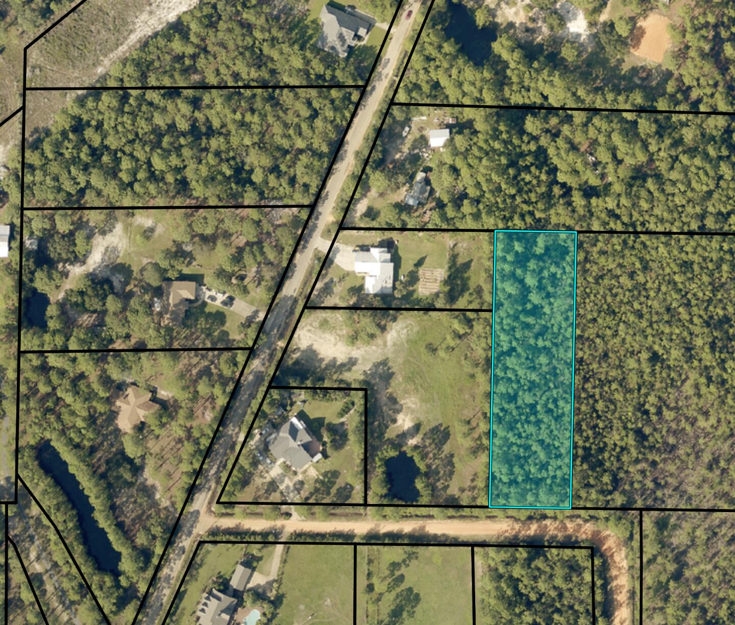 Back on market, buyer couldn't close. The Wetlands Mitigation is DONE with permits approved to build on this lush and level 1.5 acre parcel so bring the blueprints and start building your dream home. The lot has 138 ft. frontage on Windmill Drive, it's 481 ft. deep AND located in horse friendly zoning. Giddyup! Your new homesite is minutes away from a public boat launch, a quick drive from groceries, schools, and retail, and close to the Garcon Point Bridge for access to I-10.