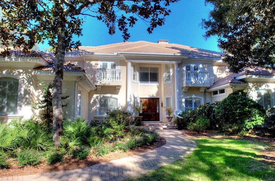 NEW PRICE! Motivated Seller says ''Bring me an offer!'' Rare find! Stunning 5BD/4+3BA custom home with expansive bay views AND on deep water! There are only a handful of homes in Destin that offer these views and deep water at the end of your private dock! Meticulously designed for gracious, comfortable living with a large foyer opening to the bay view living room that features soaring 22 foot ceiling, gas fireplace with impressive mantle and disappearing four panel glass sliding doors opening onto the screened lanai. Adjacent to the living room is a generously sized formal dining room and convenient butler's pantry, complete with sink, ice machine, wine cooler, built-in wine rack, custom cabinetry with leaded glass doors. A