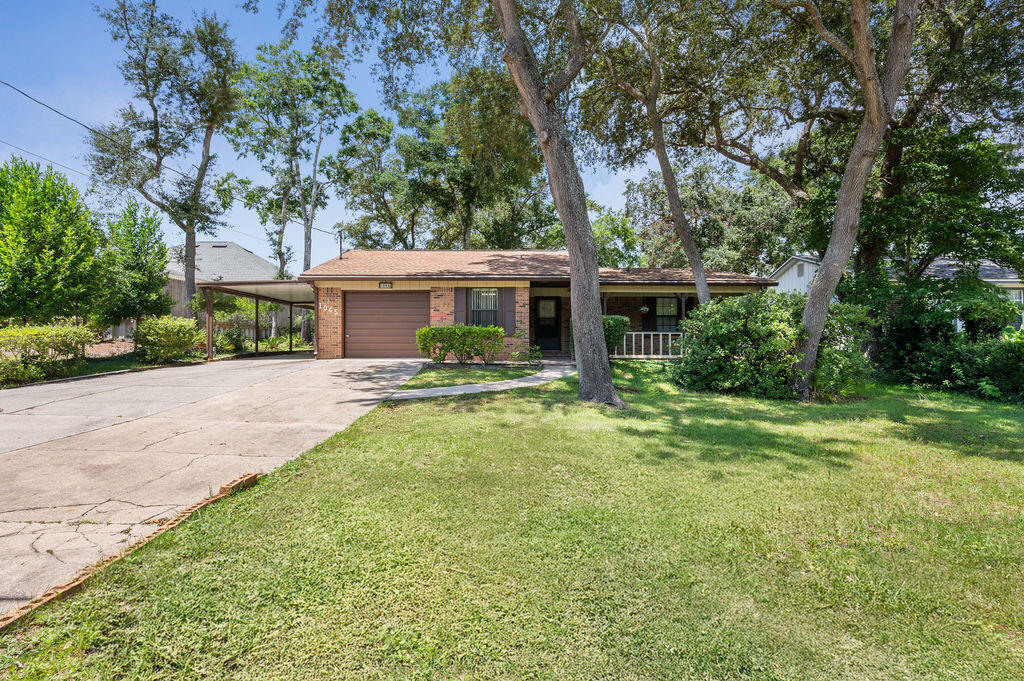 Welcome to 1045 Juniper Ave, a lovingly maintained, single-owner brick home offering charm, space, and a prime central location! This three-bedroom, two-bath residence sits right in the heart of Niceville, with parks, shopping, dining, and everyday conveniences just minutes from the doorstep.Step inside to discover a spacious layout featuring a bright, open living room with custom built-ins and an abundance of natural light. The large dining area is perfect for hosting gatherings, while the kitchen offers timeless cabinetry and a functional layout. The primary bedroom includes a generous walk-in closet and a private en suite bath, creating a comfortable retreat.Enjoy the flexibility of the enclosed Florida room. Perfect as a sunroom, hobby space, or bonus living area. Outside, the backyard boasts a beautifully maintained patio, a storage shed, and a large workshop for all your tools, hobbies, or extra storage needs.
Enhancing the property even further is a one-car garage plus a covered carport spacious enough for boat or RV parking, an added bonus rarely found at this price point. This home also features 12 solar panels with an assumable lease, helping reduce monthly utility costs and increase energy efficiency. And best of all, no HOA!
With solid construction, timeless design and endless potential, this well-cared-for home is a rare find in an absolutely unbeatable location.