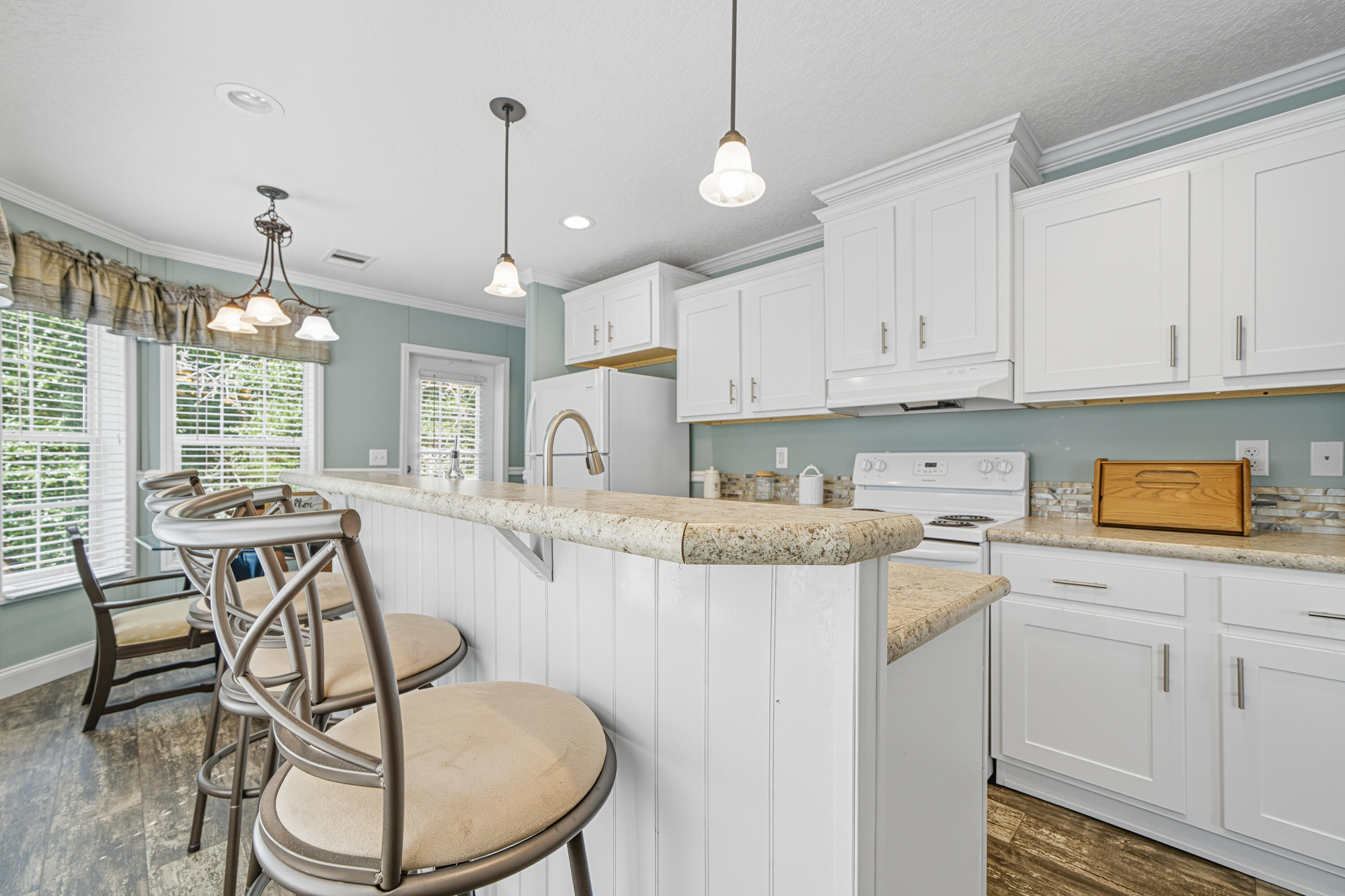 🌳 Secluded & Spacious Manufactured Home on 1.17 Acres - Move-In Ready!Welcome to your peaceful retreat! This well-maintained, practically new manufactured home sits on a huge 1.17-acre corner lot, mostly wooded for privacy and located on a paved road. Whether you're starting out or downsizing, this property offers the space and serenity you've been searching for.✨ Interior Highlights: Open kitchen with a breakfast bar, farmhouse sink, and dedicated dining area Large family room with durable vinyl flooring--perfect for easy maintenance Owner's suite with a spacious bath featuring a garden tub, separate shower, and dual vanities🌿 Outdoor Potential: Room to roam, garden, or build your dream workshop Keep the natural seclusion or clear some space for expansion