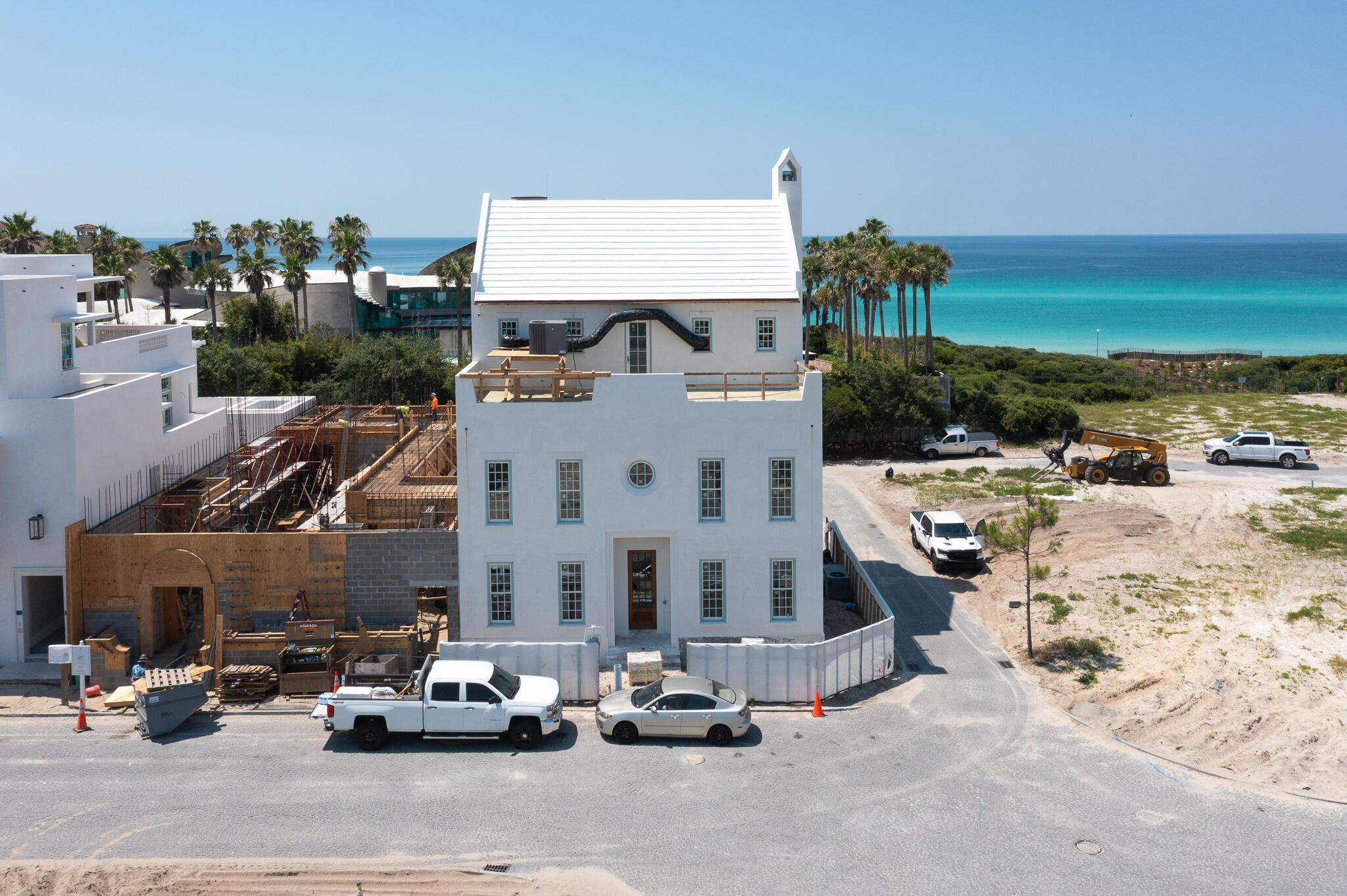 One back from Gulf Front, this Chancey Architecture designed Alys Beach home offers forever water views from its 5,356 square feet of conditioned living space. With an anticipated completion in November of 2024, this is a rare opportunity to own a new construction custom home this close to the beach in Alys Beach. To optimize water views, the kitchen, living, dining and loggia area as well as the pool and pool house are elevated to the second floor. The third floor is comprised of a large outdoor rooftop terrace at the front of the house, which overlooks the Town of Alys Beach, and an additional southern facing rooftop terrace and spacious Master Bedroom Suite look out to the beach and water views of the Gulf of Mexico. There is elevator access to all three floors. A large two car garage and 851 square feet of enclosed storage takes care of all storage needs.
Upgraded finishes, fixtures and appliances are found throughout this home. A full furniture package has already been selected for the home by Chancey Design and may be purchased separately.