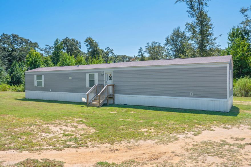 SELLER WILL CONTRIBUTE UP TO $5,000 TOWARDS CLOSING COSTS! Sitting on over 1.5 serene acres with no HOA, this home is ideal for those who value the outdoors, space, and privacy. Escape to peaceful country living with this 2023 4BR/2BA manufactured home featuring a new HVAC, water heater, and roof--all the same age as the home. The split floor plan offers privacy with the master suite on one side and 3 bedrooms on the other. With space to spread out, and the opportunity to build your forever home, this quiet parcel is the perfect place to put down roots, and grow at your own pace! Start a homestead, grow a garden, or add a workshop/barn!10 minutes to Karick Lake & Baker School, ~33 min to Duke Field. Eligible for VA & FHA financing.