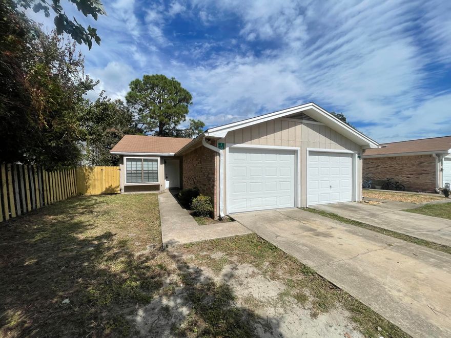 Beautiful fully renovated 2-bedroom, 2 full baths make townhome. This one-story all tile end unit was been freshly painted, new granite counters in the kitchen as well as both bathroom vanities, new light fixtures, and much more. A separate dining area with a large window seat that leads to the kitchen with newly painted cabinets & brushed nickel hardware with sleek black appliances.  Enjoy the large fenced in backyard and one car garage. Minutes from Hurlburt Field, public beach access, shopping and restaurants, but the highlight is this unit is walking distance to Edwins Elementary, Fort Walton Beach High School and short walk to Bruner Middle School! Pets allowed restrictions apply. Military discount