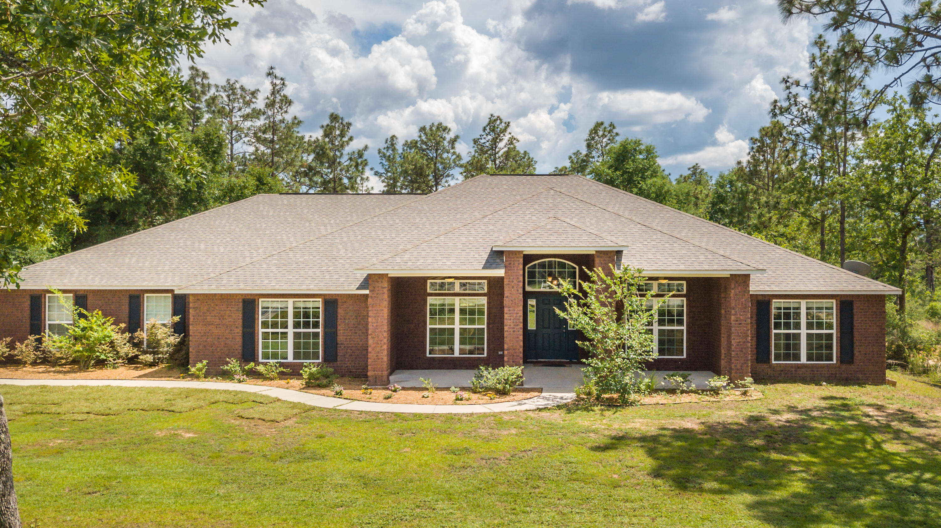 Large home on a great 1 acre lot! This home delivers on space, both inside and out! Fantastic floorplan offers up 5 large bedrooms and 3 full bathrooms. The kitchen is the heart of the home, with granite countertops, ample cabinet space, dual ovens, hop up counter bar, and 2 (TWO) walk-in pantries. Directly off the kitchen is a massive laundry room with additional cabinets and utility sink. The master bedroom is large in size, but home also has an additional bedroom with it's own bathroom, making this the perfect setup for a 2nd master or in-law suite. The massive covered back patio is the perfect spot to enjoy the 1 acre fenced backyard. Yellow River Plantation also features trails, stocked fishing ponds, and a playground for the little ones.