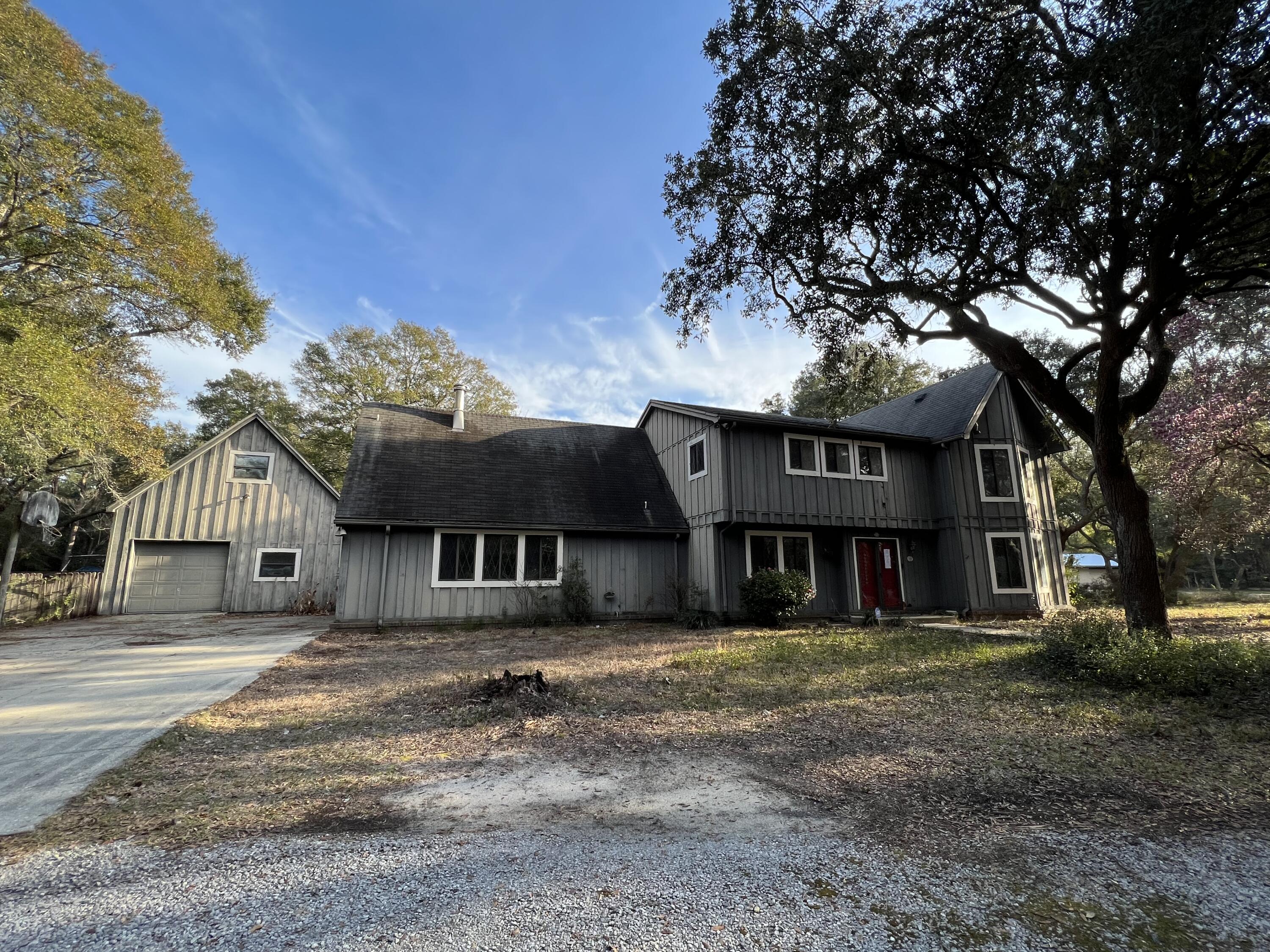 This REO home located in the ever popular Rocky Bayou subdivision is one to see if looking for a large home with acreage in Niceville with plenty of sweat equity. Main home is 2 stories with all bedrooms, including master bath and full bath upstairs. Laundry is part of the upstairs bonus room. Downstairs, there is a full bath just off the garage for guests, open kitchen with seating, entertainment area next to the fireplace. Separate living room and family rooms are just off the front door. Outside -huge covered porch, inground pool, and a massive, cleared back yard. Square footage includes a detached garage with bonus room that has it's own central AC. Due to condition, card or hard money/rehab loans only.