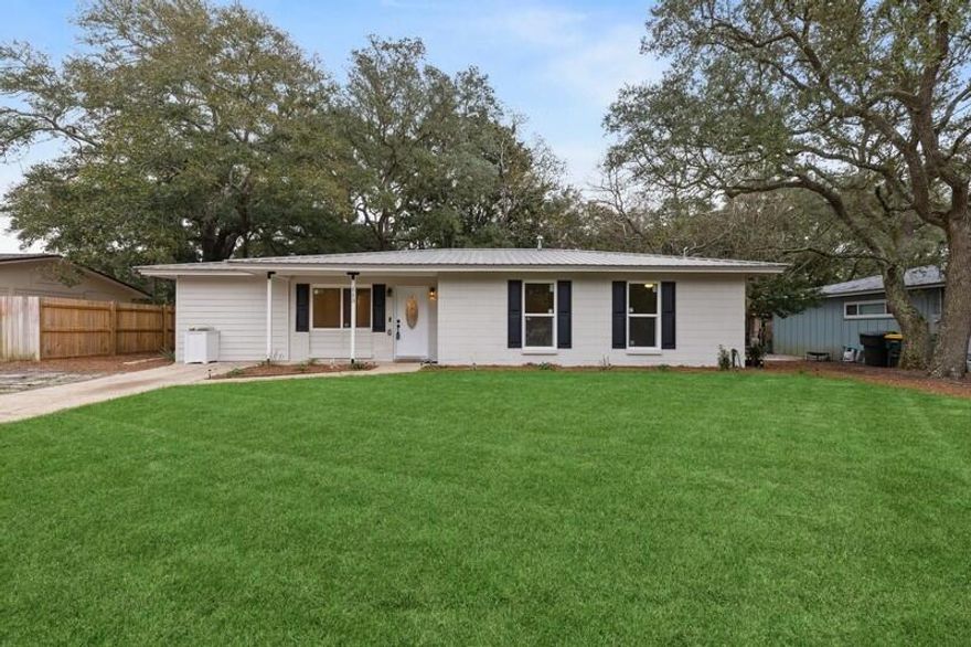 Welcome home to this completely, freshly updated 4 bedroom, 2 bath home in beautiful Ft Walton Beach 2 blocks from the Gulf! You will love the open concept living space and split bedroom floor plan. New water-resistant laminate flooring and all neutral, fresh paint with new white trim throughout. The fully updated kitchen has brand new, bright white cabinets with soft closing drawers and doors that go to the ceiling. Base cabinets are topped with stunning new sealed granite and kitchen is equipped with brand new Samsung stainless appliances with Wi-Fi programmable stove. There is a window over the kitchen sink with a nice view into the back yard, and convenient breakfast bar seating. Full custom-built pantry off of the kitchen and the updated, large laundry room with recessed lighting.