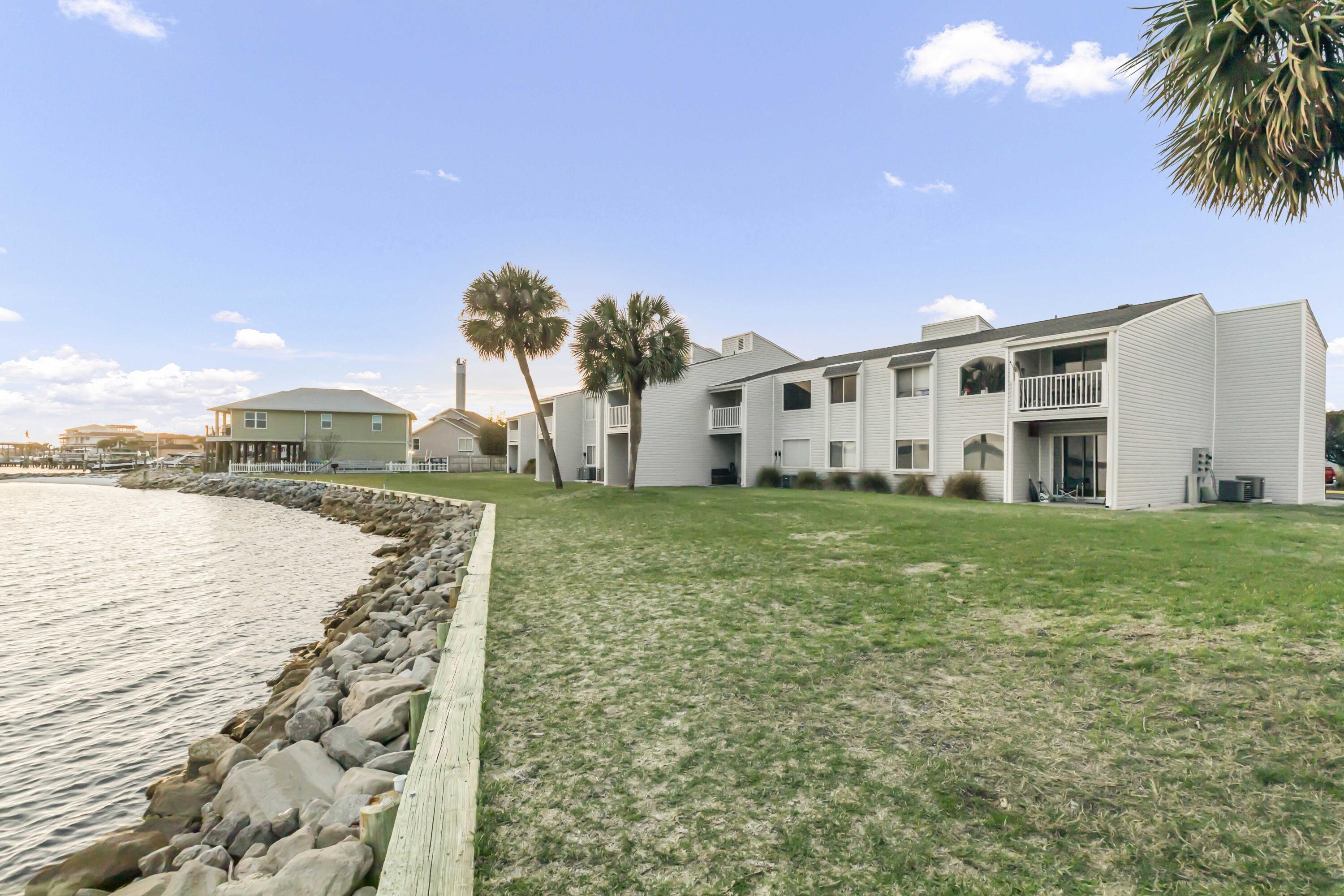 Welcome to this 2-bedroom, 2 full bathroom condo with views and a balcony overlooking the Choctawhatchee Bay. This clean, move in ready property has new luxury vinyl planks in the living areas, hard surface flooring in the bedrooms, and tile in kitchen and bathrooms. Kitchen features granite countertop with overhang for countertop seating. This property is in a gated community that offers a pool, laundry room, racquetball courts and assigned parking. Water, sewer and garbage are included.Lease terms: 12 months.All occupants 18+ must complete application to include background and credit check.