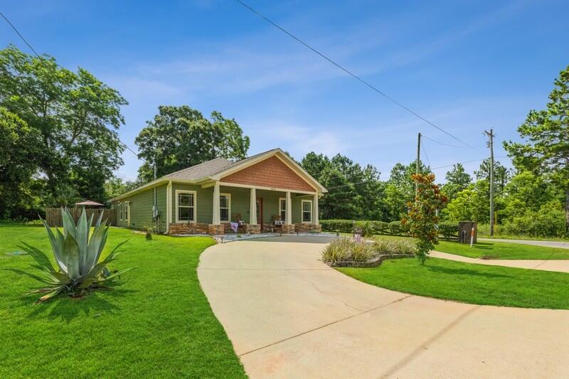 OPEN HOUSE Friday JUNE 24TH 2-4 PM Beautiful POOL HOME and Private Retreat!!! The backyard is beautifully landscaped around a stunning saltwater pool...you will truly feel as if you've escaped to your own paradise. The 5 BD/2.5 BA Craftsman style home is located on a large corner lot complete w/ wood-look tile and plantation shutters throughout! The home features an open floor plan and great layout. Kitchen boasts lots of cabinets, breakfast bar, center island and granite countertops. Master suite is spacious and features dual vanities, walk-in closet and shower. All guest bedrooms are a nice size. The home fronts two streets and features a side load garage. Perfect home for entertaining! Covered rear porch, fenced back yard and coordinating yard building! HVAC was replaced Feb 2022