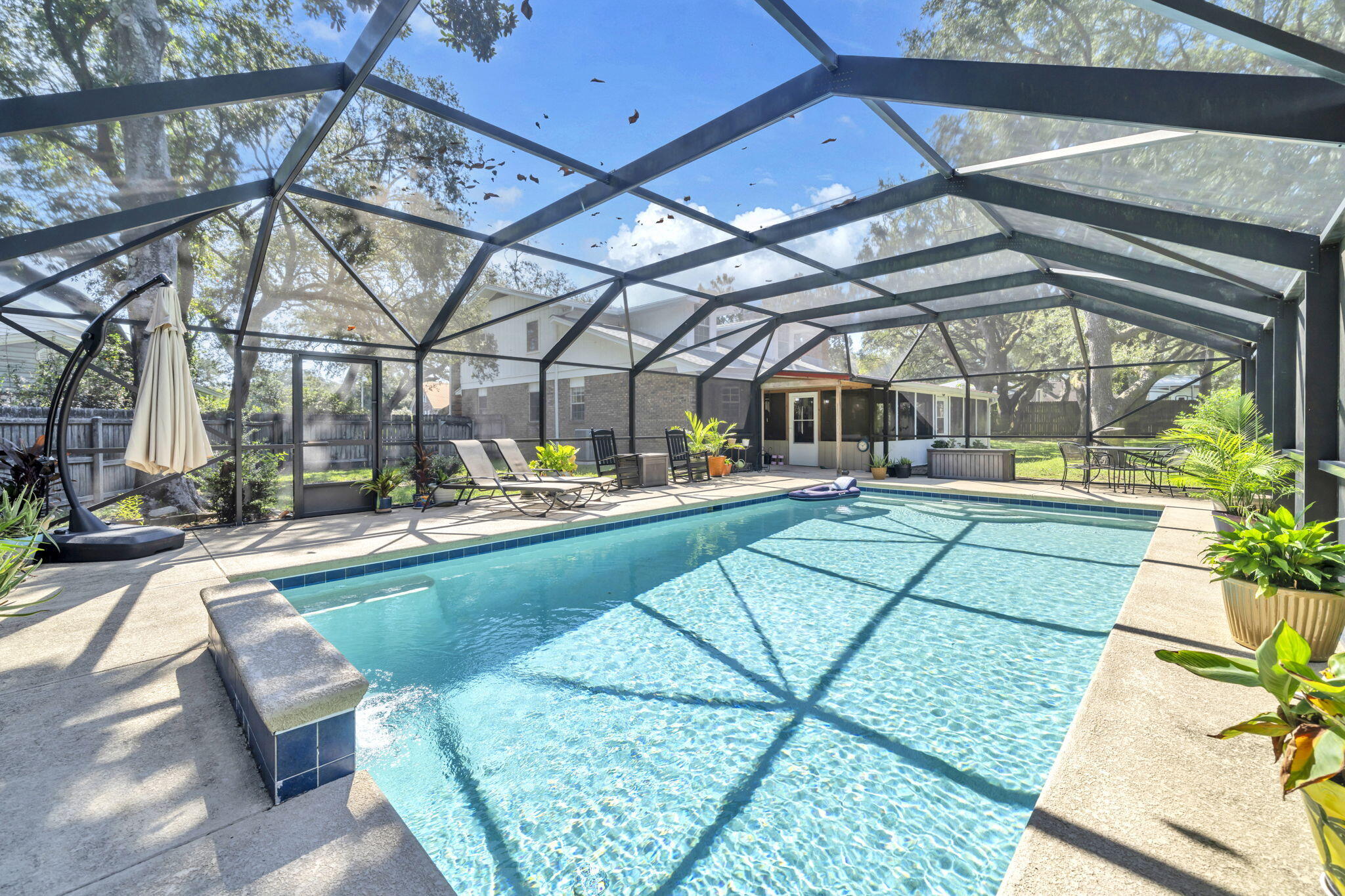 Your Private Pool awaits! Tucked quietly at the end of a peaceful cul-de-sac and shaded by the sweeping limbs of grand live oaks, this 5-bedroom home with a bonus room offers more than just square footage -- it offers a lifestyle.Set on over half an acre, this property has been a cherished home where children rode bikes with neighbors, summer afternoons were spent swimming under the sun, and the warmth of two fireplaces brought loved ones together during the holidays. Pride of ownership is evident throughout, from recent updates to timeless features that make everyday life both comfortable and beautiful.The Heart of the Home-The expansive kitchen is truly the heartbeat of this house -- thoughtfully designed for large families and those who love to cook and gather. Read more.. Featuring custom honey oak cabinetry, solid-surface countertops, a six-burner gas stove with griddle, double ovens, and three full pantry cabinets, there's no shortage of space or functionality. A built-in desk area served as the family's command center, while a charming bay window frames views of the backyard - perfect for keeping an eye on the kids playing or swimming, all the while dinner simmers.
- Living Spaces That Evolve With You -
The home flows effortlessly between spaces meant for connection and retreat. A large family room, bathed in natural light, showcases two gas-log fireplaces with remote controls and windows that overlook the park-like backyard.
The formal dining room easily accommodates big family dinners, holiday celebrations, or quiet evenings with friends. Nearby, a versatile front sitting room has served as a homeschool classroom, teen hangout, and a cozy space for guests.
Need privacy to work or read? A separate office/bonus room downstairs makes a perfect retreat.
-Bedrooms and Baths Designed for Comfort-
The home offers five spacious bedrooms, including one downstairs that's ideal for guests or multi-generational living. Upstairs, four additional bedrooms and two recently renovated full bathrooms provide plenty of room for a growing family. There's also a full and half bath on the main level, perfect for guests and busy mornings.
-Outdoor Living You'll Never Want to Leave-
Step out onto the screened-in back porch, your personal sanctuary to enjoy sunsets, summer breezes, or a morning coffee - all bug-free. The crown jewel of the backyard is the 18x36 heated saltwater pool, fully screened and usable yearly round (heater). With two sitting ledges, this pool has been the backdrop to countless family memories.
The large, shaded backyard is ideal for play, gardening, or simply soaking in the quiet under the oaks. A large shed offers ample storage for lawn and pool equipment.
-Upgrades & Peace of Mind-
New roof on home and shed - 2024
New gutter system - 2024
New hot water heater - 2025
Upstairs HVAC - 2022 (regularly maintained)
Downstairs HVAC - 2023 (regularly maintained)
Kitchen appliances - less than 5 years old
All copper wiring
Two walk-in attic storage spaces
-A Neighborhood Meant for Families-
Beyond the property, this home sits in a friendly, low-traffic cul-de-sac, where neighbors know each other by name, and kids safely ride bikes until dusk. It's just a 3-minute golf cart ride to a gated golfing community and only a few minutes to the beaches. Enjoy public access to Meigs Park on the Bay (1 mile away) - perfect for kayaking, boat launch, paddle boarding, or catching summer fireworks or the park!