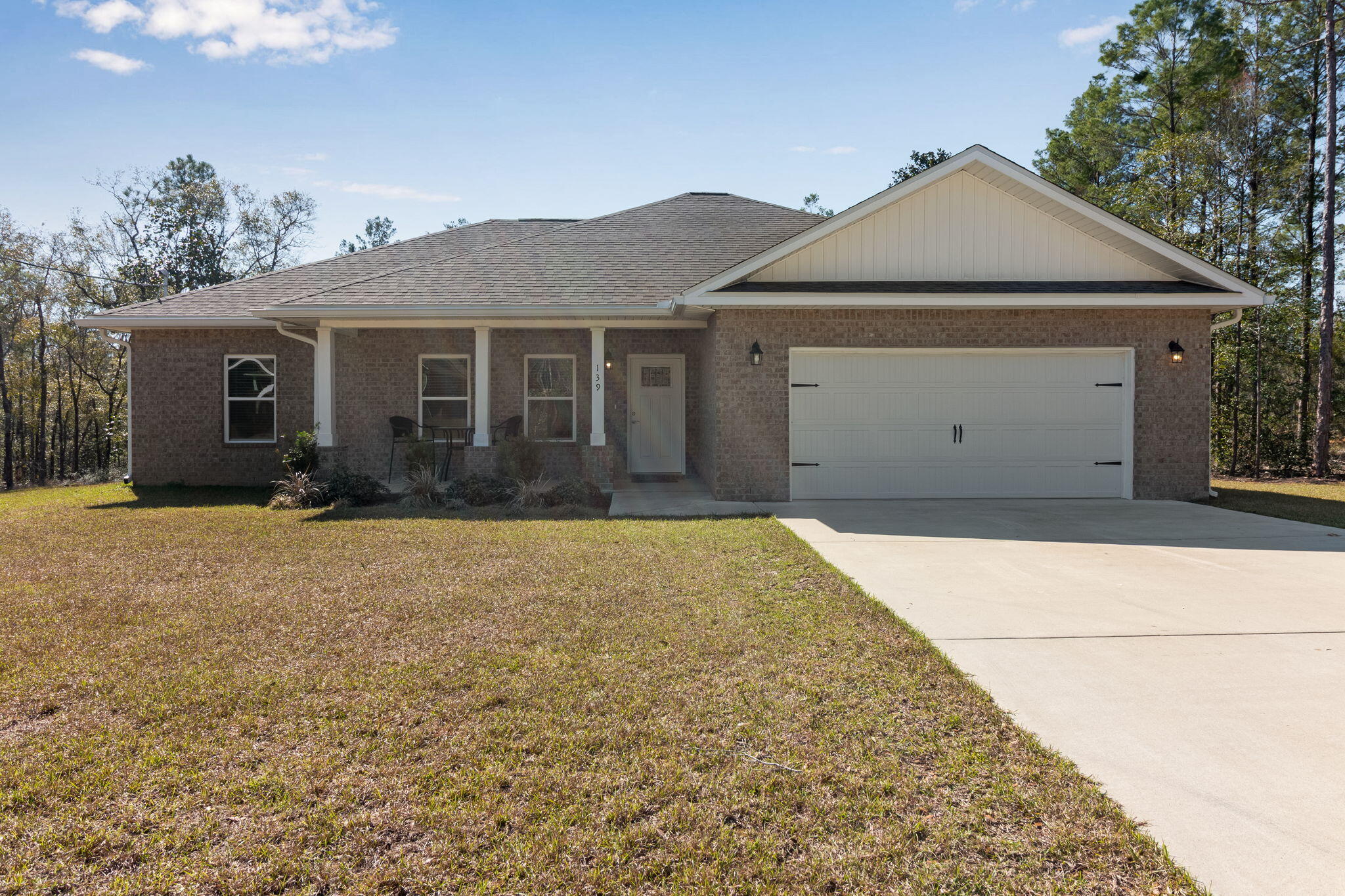 Discover this practically new home in DeFuniak Springs, featuring an open-concept design with abundant natural light and a modern color scheme. The kitchen is equipped with stainless steel appliances, granite countertops, and a spacious layout perfect for entertaining. Tray ceilings add an elegant touch, while LVP flooring flows seamlessly throughout. Enjoy this homes over-sized lot and its split floor plan, making it ideal for families or guests and entertaining. Enjoy a perfect blend of style and functionality in this beautifully designed home!