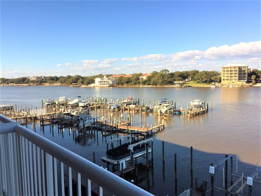 This 4th floor unit at Palm Court Yacht has amazing westerly views of the intercoastal waterway. The interior has been completely redone with beautiful flooring, granite countertops in the kitchen, upscale appliances, 9 foot ceilings. The master bath has a separate garden tub and shower. The views from the master bedroom are stunning. The unit comes with covered assigned parking and A BOAT SLIP. The boat slip has a gear driven lift 9000 pound capacity lift that accommodates two jet skis or a large boat. And of course it can be remotely operated. You can be at Crab Island or the Gulf in minutes or just enjoy the sunsets from the dock. Palm Court is a gated, waterfront community located on