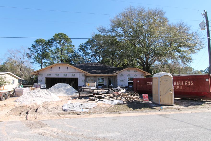 Great location!!! East of Hurlburt in Mary Esther, a mile or so away. Awesome new floor plan by multiple award winning builder!! This 4/2 custom brick home has super curb appeal, and is being constructed on large lot There are 10 Ft. Ceilings w/ impressive crown molding, will have hand scrapped hardwood flooring, and 5 1/4'' baseboard throughout the main living areas. As you enter the home through the covered front porch, the formal dining room is on your right. As you continue down the hallway, you will then enter the chef's delight kitchen which will boast custom maple cabinetry, granite countertops, 2 large pantry's, and stainless appliances (including an oversized commercial grade frig./freezer). Please view photos for appliance info. This plan is a split bedroom, where bedrooms 1 - 3, and baths 1 and 2, are located at the right of the home. The master suite is in the rear of the home, is very roomy, has 2 large walk - in closets, a custom tiled walk - in shower with class enclosure, a whirlpool garden tub, a double vanity and a linen closet. The laundry room is conveniently located at the rear of the kitchen. The oversized greatroom is located at the rear of the kitchen, and opens to a covered porch, which is perfect for entertaining. The yard will be beautifully landscaped, have a privacy fence, and comes complete w/ a well, sprinkler system and timer. Insurance will be very reasonable, as home is built to today's code. Home has a Taexx ''in the wall'' pest control system that is serviced from the exterior of the home, for owner's convenience. Completion is expected in late March. 