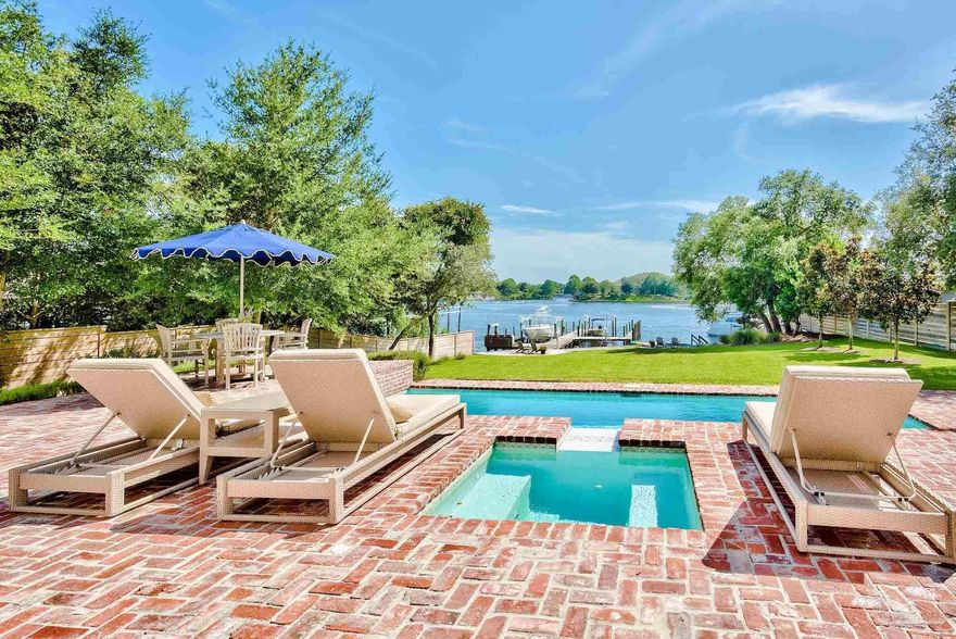 Discover a rare opportunity to own the pinnacle of coastal living in this custom-designed masterpiece, gracefully poised on .92 acres of protected deep water in Destin's coveted Joe's Bayou. This 2018-built estate, elevated over 20 feet above sea level, seamlessly blends Southern sophistication with modern luxury, offering 6,456 sq ft of unparalleled craftsmanship and amenities. The tranquility of the private tree-lined drive sets the stage for the exquisite finishes found throughout this captivating property. The residence unfolds with aged French Oak flooring and wall-to-wall glass, seamlessly connecting the interior to breathtaking water views and establishing a perfect setting for indoor/outdoor entertaining. Meticulous attention to detail is showcased in the custom millwork and soaring, crown-molded ceilings, contributing to the distinguished and timeless character of this home. 

Indulge your inner chef in the show-stopping kitchen, equipped with top-of-the-line Thermador appliances, elegant quartz countertops, bespoke inset cabinetry, and an impressive butler's pantry. The formal dining room, with its artfully designed ceiling, provides an elevated setting for memorable gatherings. Indulge in the ultimate waterside escape within the expansive master suite, nestled in the northwest wing, complimented by a spa-inspired ensuite with his-and-her custom closets, a testament to thoughtful design for the most discerning individual. 

Your waterfront paradise unfolds outdoors, featuring a stunning brick paver heated saltwater pool and spa, a fully equipped summer kitchen for effortless alfresco dining, and an oversized private dock with dual boat lifts and a jet ski lift, offering the quintessential Destin boating experience. From its prized location in Destin's most coveted enclave, this exceptional estate offers unparalleled access to Crab Island, East Pass, and the limitless Gulf. 

Additional notable features include two private office spaces, an extended three-car garage, and exceptional storage throughout. With no HOA and situated in an X Flood Zone (no flood insurance required), it offers both freedom and security. The generously sized upstairs bedroom with an ensuite is a versatile space, perfect for a game room, entertainment area, or gym; combining privacy, space, and flexibility. Now is your chance to acquire this rare legacy waterfront property, a source of joy and lasting value for generations to come! 

VIEW VIDEO TOUR: 
https://docsend.com/view/exysvnyw5yswvepn