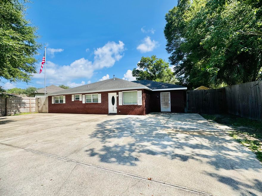Welcome to this modern sanctuary brick home offering 4 bedrooms, 3 baths, & a versatile flex room. This exquisite residence showcases tile bathrooms and a stylish barn door in the expansive main ensuite boasts an equally impressive bath, creating a private retreat in this split floorplan. All 3 bathrooms reflect modern finishes, creating sophisticated charm. The large, modern kitchen is a chef's dream, featuring granite countertops, rich wood cabinets, & modern appliances. The open living space flows seamlessly into the kitchen/dining, enhanced by crown molding, smooth ceilings, & recessed lighting. Rich wood floors span the home, creating a warm & inviting atmosphere. The property offers ample parking to accommodate a large family. The spacious backyard provides a safe play area...