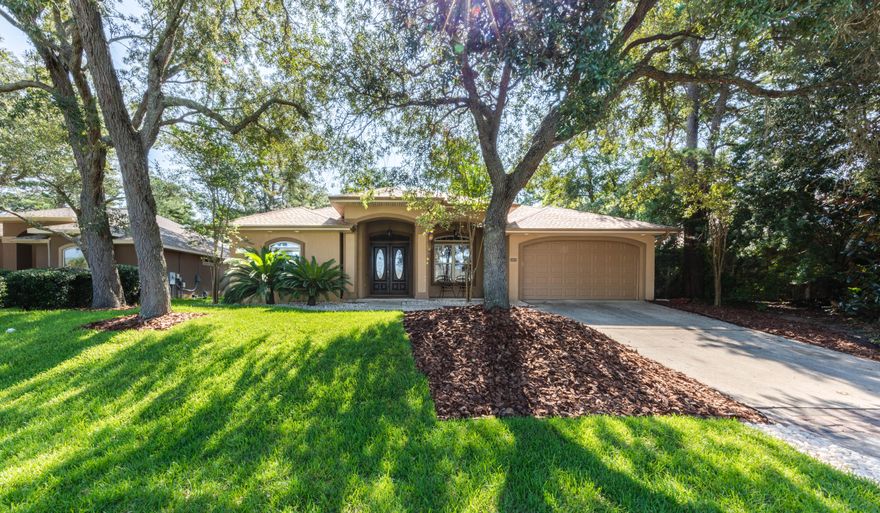 Welcome to the quaint Chardonnay Estates community. Centrally located in Bluewater Bay. Just a short 15 minute drive to the white sandy beaches. This beautiful contemporary home is very welcoming as you enter through the double entry doors to an open floor plan.  Did I mention the new ROOF, HVAC, and garage door? There are many architectural details throughout. Some highlights are the 11' tray ceilings, dual fireplace, recessed lighting, art niches, and lovely shelving edges. The gourmet kitchen has stone backsplash and gas stove. Appliances were updated in 2017. The master bathroom has dual shower heads, and his/her walk-in closets. Enjoy sitting on the covered front porch or lounging in the bonus room off of the living area. Great for an office! Small yard means less yard work. Must see!