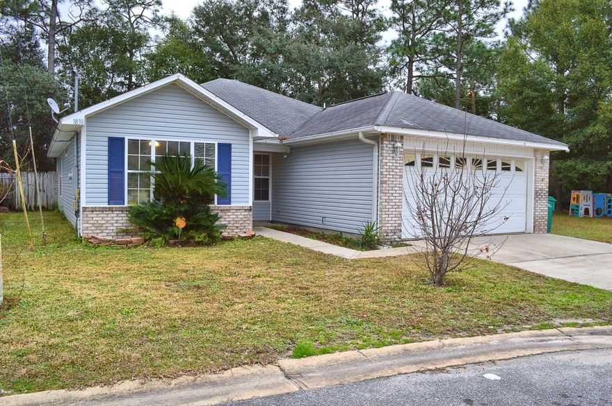 Welcome home! This 3 bedroom, 2 bathroom home sits on a quiet street just 10 minutes from both Eglin and Hurlburt. This home features tile throughout the living and wet areas and virtually new carpet in the bedrooms (6 months old). The HVAC system is less than 3 years old and the water heater was replaced in 2012. The vanities in both bathrooms have been updated. The master bathroom features double sinks and a walk in closet! There is a covered porch out back so you can enjoy your privacy fenced backyard rain or shine! This home also comes with a video surveillance system and is pre-wired so you can set up service to view your cameras from your phone! You can have peace of mind even when you're not home. You can control your thermostat from your phone as well!