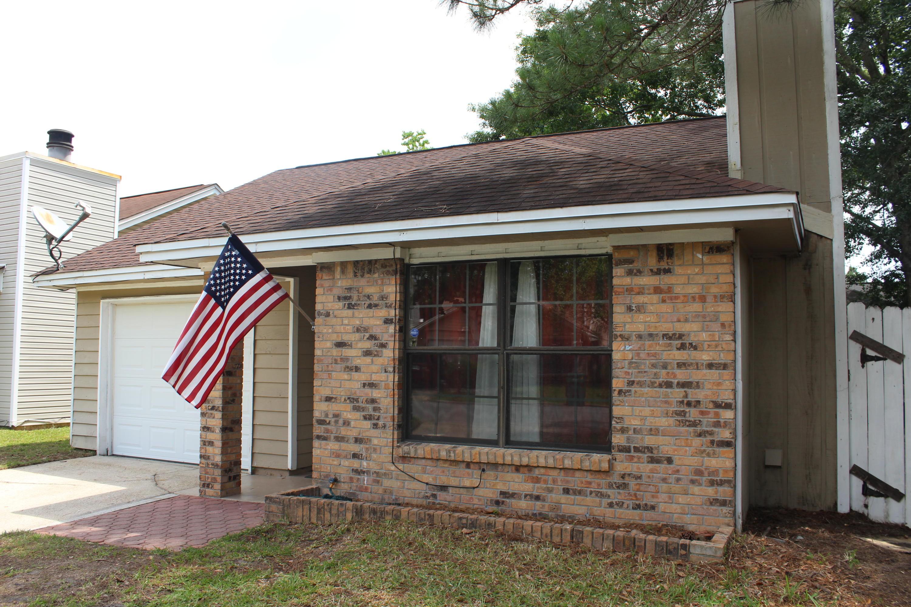 Adorable 3 bedroom and 2 bath home with 1172 sq ft located near the bases, shopping, and beaches! This home was renovated between 2011 and 2012 with a new roof, new HVAC, new laminate flooring, light fixtures, Espresso bathroom cabinet with brushed nickel faucet, stained kitchen cabinets and updated counter tops, and stainless and black appliances! Enter the home and notice the vaulted ceilings with the living/dining area opening to the kitchen. A sliding glass door in the dining/living area opens to a large, open patio overlooking the fenced side yard! In addition the living room features a fireplace and double windows overlooking the front yard! The home also features a master bedroom with an en-suite bathroom.