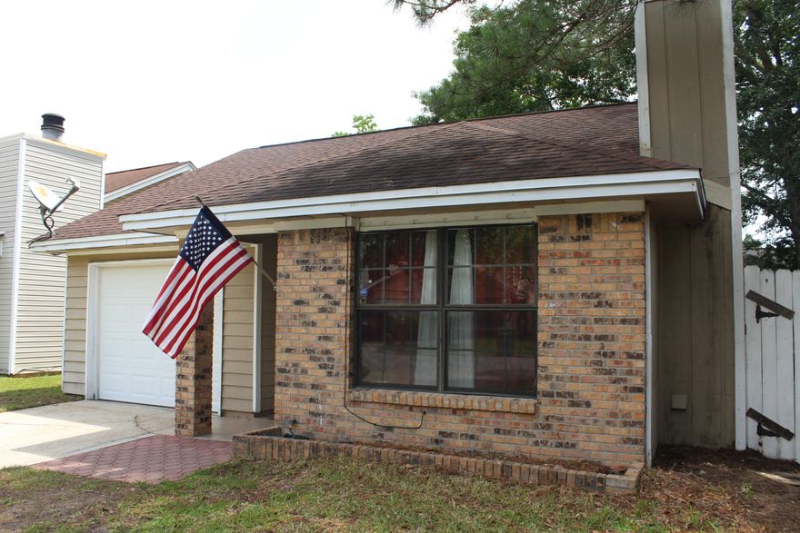 Adorable 3 bedroom and 2 bath home with 1172 sq ft located near the bases, shopping, and beaches! This home was renovated between 2011 and 2012 with a new roof, new HVAC, new laminate flooring, light fixtures, Espresso bathroom cabinet with brushed nickel faucet, stained kitchen cabinets and updated counter tops, and stainless and black appliances! Enter the home and notice the vaulted ceilings with the living/dining area opening to the kitchen. A sliding glass door in the dining/living area opens to a large, open patio overlooking the fenced side yard! In addition the living room features a fireplace and double windows overlooking the front yard! The home also features a master bedroom with an en-suite bathroom.