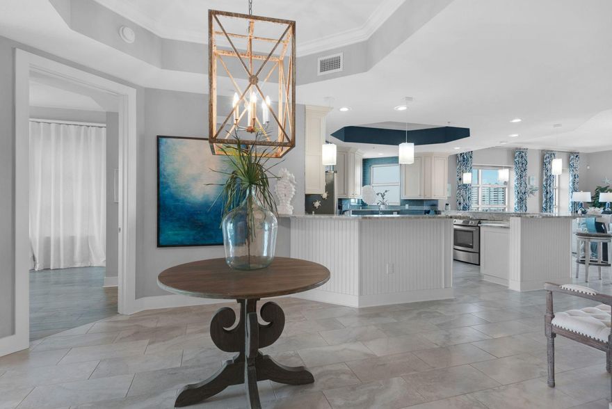 For those who want to embrace life on the water, this incredible Harbor Lights condo ticks all the boxes. The spacious unit comes with a boat slip with 10,000 pound lift just steps from the door, private garage and storage room. After a day of boating, fishing and watersports, return home to this beautiful condo where every room has exceptional views of the Harbor, East Pass and the Gulf of Mexico. One of just 39 units in a contemporary building, the condo enjoys an unusual amount of privacy due to its design, location, and newly gated entrance. This exclusive condo has its own wow factor with an open plan living room with a calming, coastal color palette and great attention to detail. It has a split floor plan with three water view bedrooms with en-suite bathrooms, an office/bunk room,