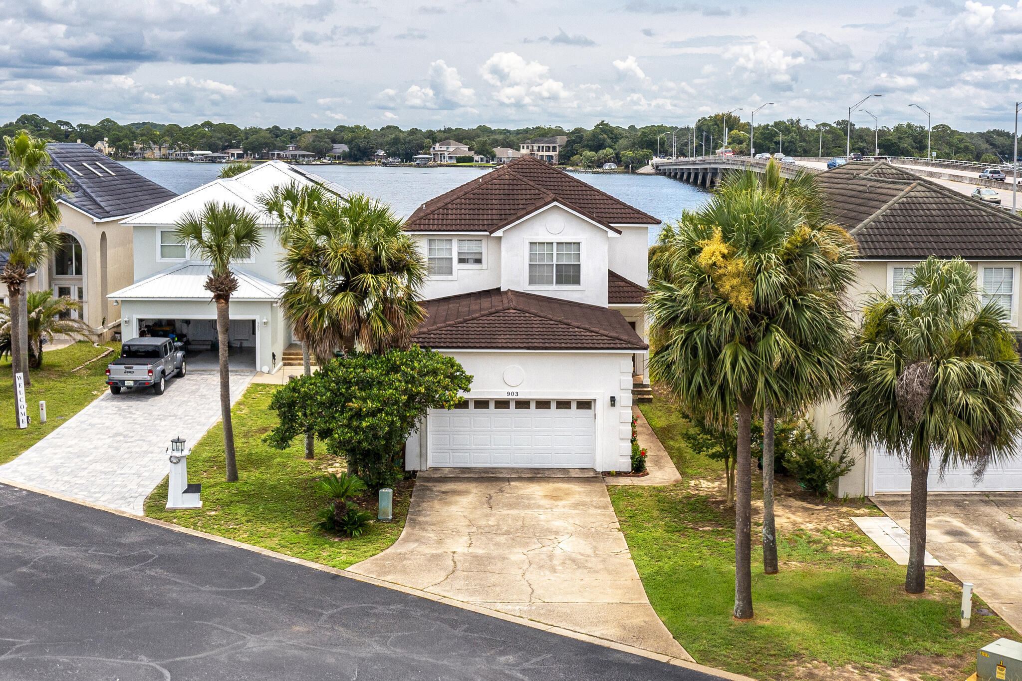 Waterfront property in Lighthouse Point sits on the Bayou off Choctawatchee Bay. This spacious, 4 bed, 3.5 bath home is open and bright with water views the moment you walk in. Upstairs there is an Oversized Master Suite that overlooks the water, with a huge walk-in closet, tile shower and double vanity with tons of cabinet space. There are also 2 additional bedrooms and a full bath. On the main level there is a second Master Suite Option. There is a private dock with a boat lift, perfect to take your boat on a short trip to the nearby waterfront restaurants and Crab Island.