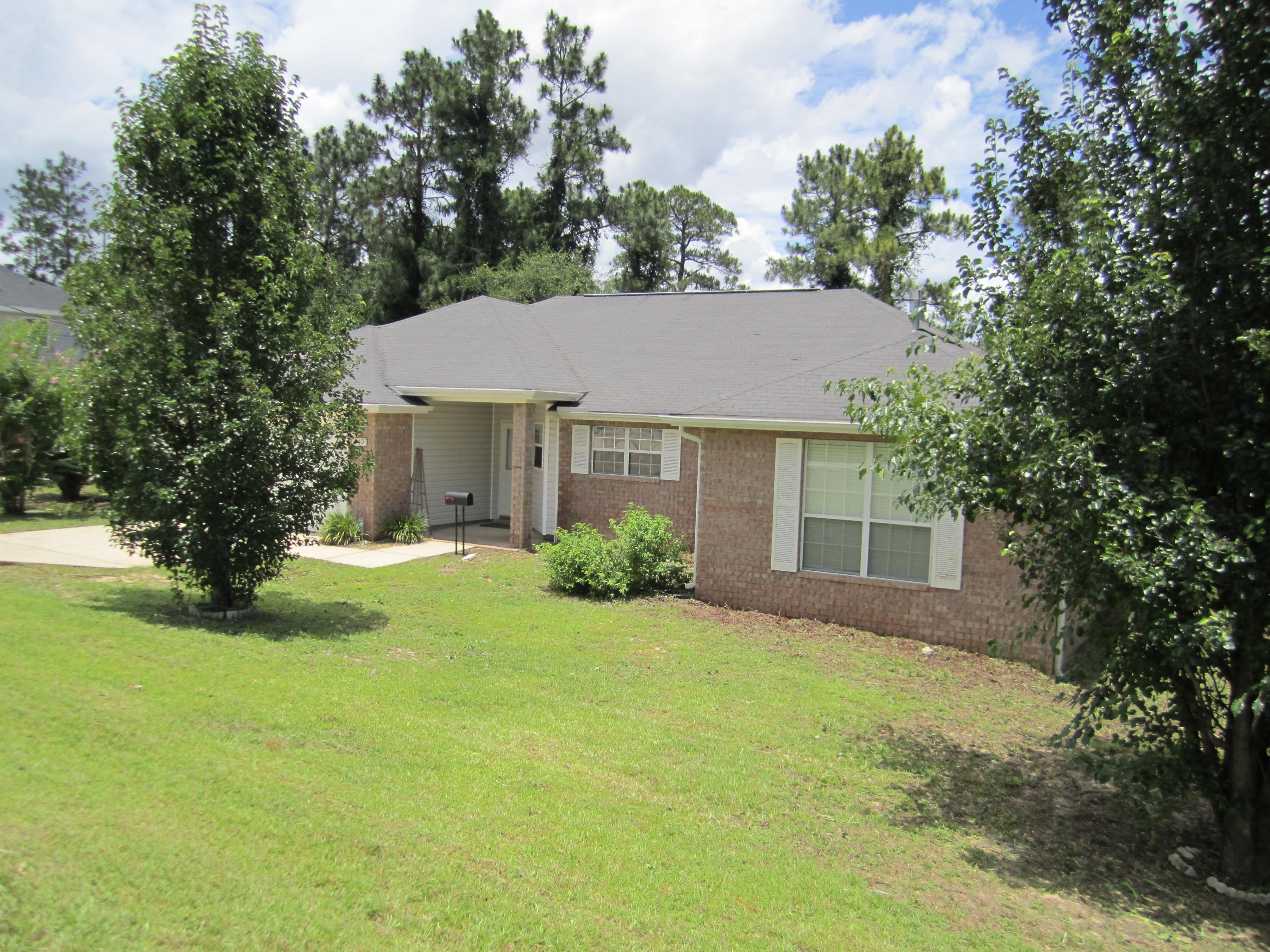 Looking for seclusion on the south side of Crestview? Well you found it! This home backs up to a wooded area and has an incredible view. The interior of the home is clean and well-kept with new brand new carpet and vinyl flooring throughout the home. The floor plan is very desirable with an open kitchen and great room as well as a split bedroom plan. The kitchen is large with lots of cabinet space and a center island for meal preparation. The Master suite is off the living room. The master bath has double vanities, a soaking tub and a separate shower. The additional bedrooms are all at the opposite end of the home and are quite large. There is an awesome covered and screened porch that spans the back of the home and looks out over the creek beyond the property.