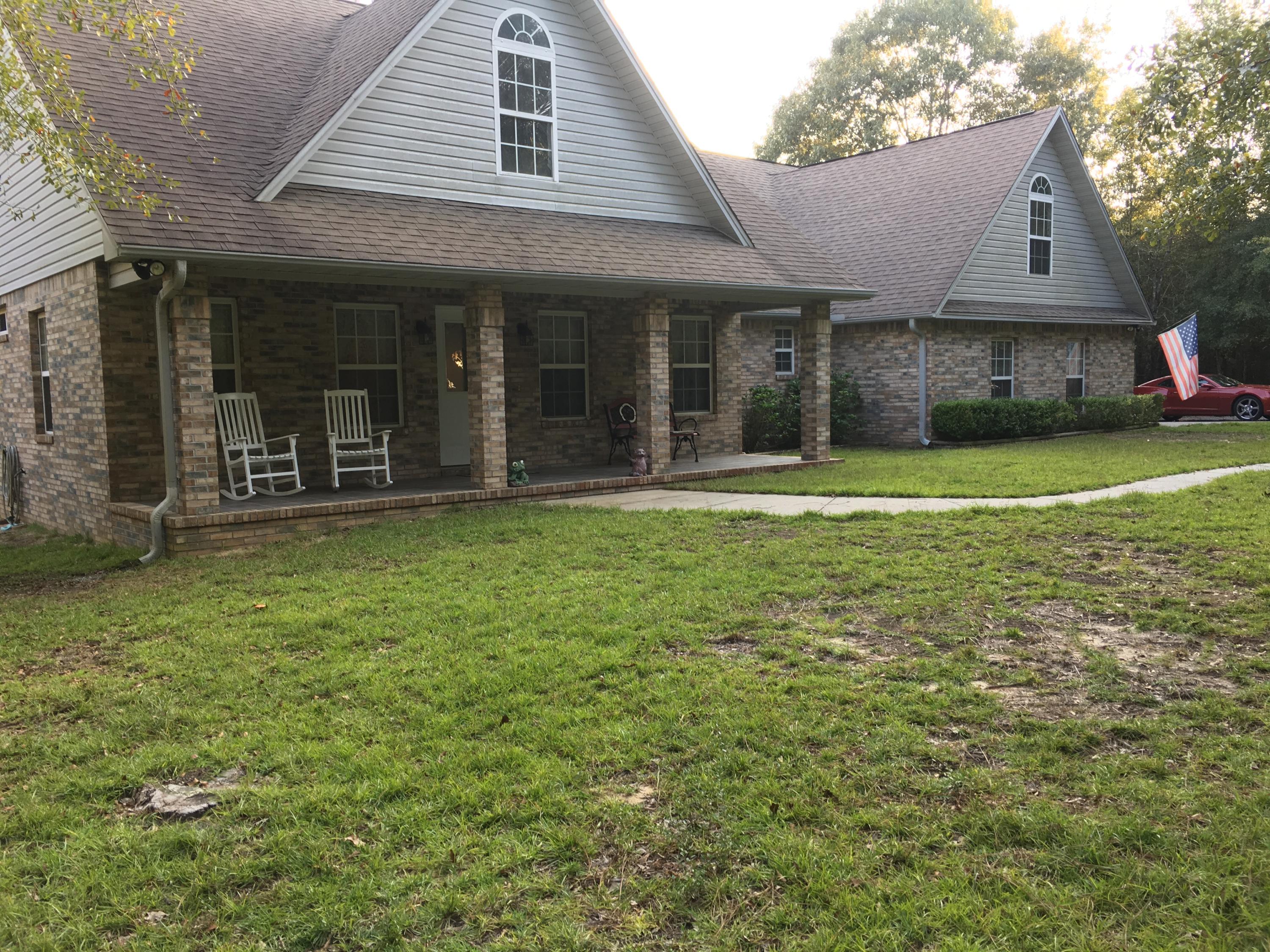 Enjoy country living at its finest, this 3 bedroom 2 1/2 bath sits on 4 acres of prime Baker real estate. Workshop and covered parking area for rv/boat or shade tree mechanic. This level 4 acre parcel has plenty of shade trees and room to grow.