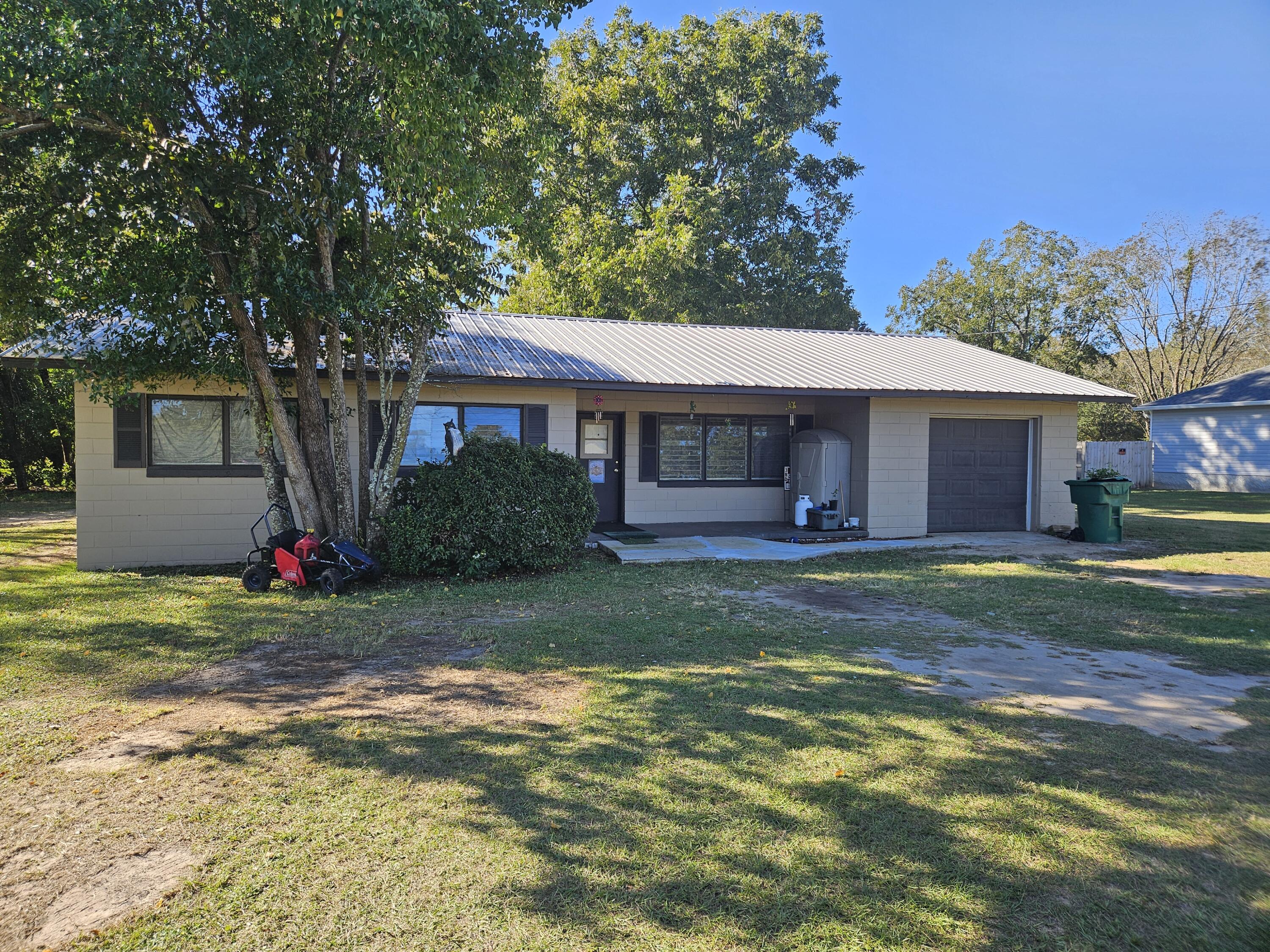 3 bedroom and 1 bath block home with a metal roof on 1 acre.  County zoning. Conveniently located in north Crestview not far from the High and Middle schools, Publix, movie theatre and a handful of restaurants.  Level lot.  Home needs some work and will not qualify for VA/FHA financing.  Good bones.