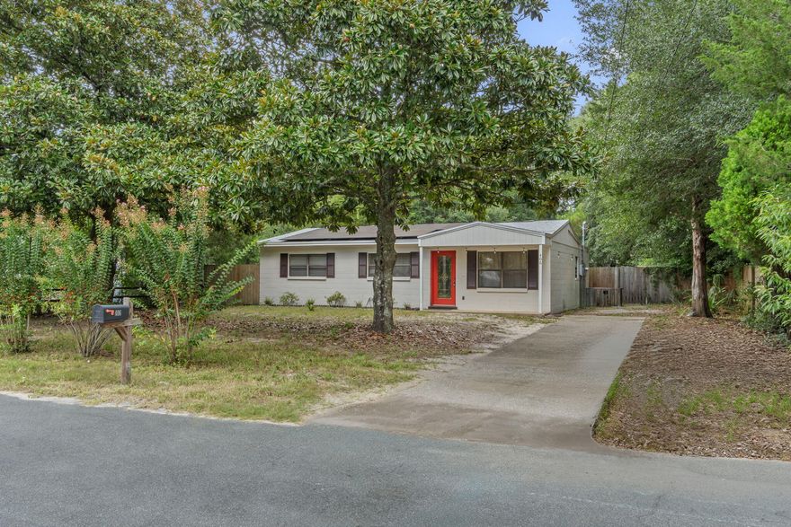 Awaken to the serene coastal charm of 406 Ed Street, a delightful retreat nestled in the heart of Fort Walton Beach, FL. This inviting 3-bedroom home offers a spacious 1408 sq ft of comfortable living space, perfect for creating cherished memories. The open floor plan seamlessly blends the living and dining areas, providing a welcoming atmosphere for entertaining friends or enjoying quiet evenings. Natural light floods through the large windows, highlighting the beauty of each room and creating a warm, inviting ambiance.
