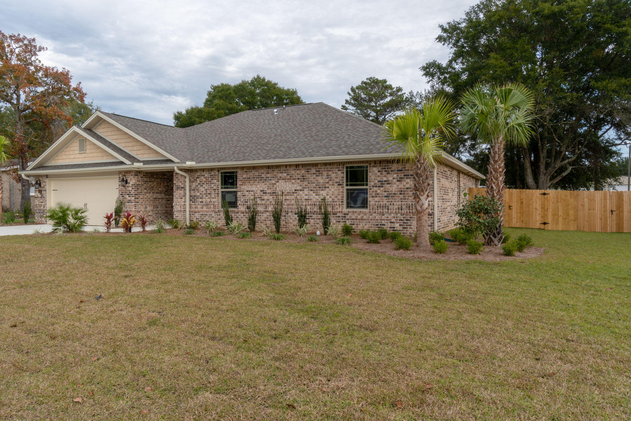 Make sure and ask your agent to forward you the Matterport 3D tour. New construction in the heart of Fort Walton Beach is a rare find! This all brick home is virtually maintenance free. From the neutral paint palate to the mix of 18'' ceramic tile and luxury vinyl wide plank flooring in the living areas, this home is sure to please. Notice the oil rubbed bronze lighting fixtures throughout the home that add to its elegance. The kitchen nicely appointed with richly stained maple cabnitrey, sleek granite, and LG stainless appliances. Don't miss the center island, it's great space for meal preparation! The kitchen looks out to the family room which features double tray ceiling with indirect