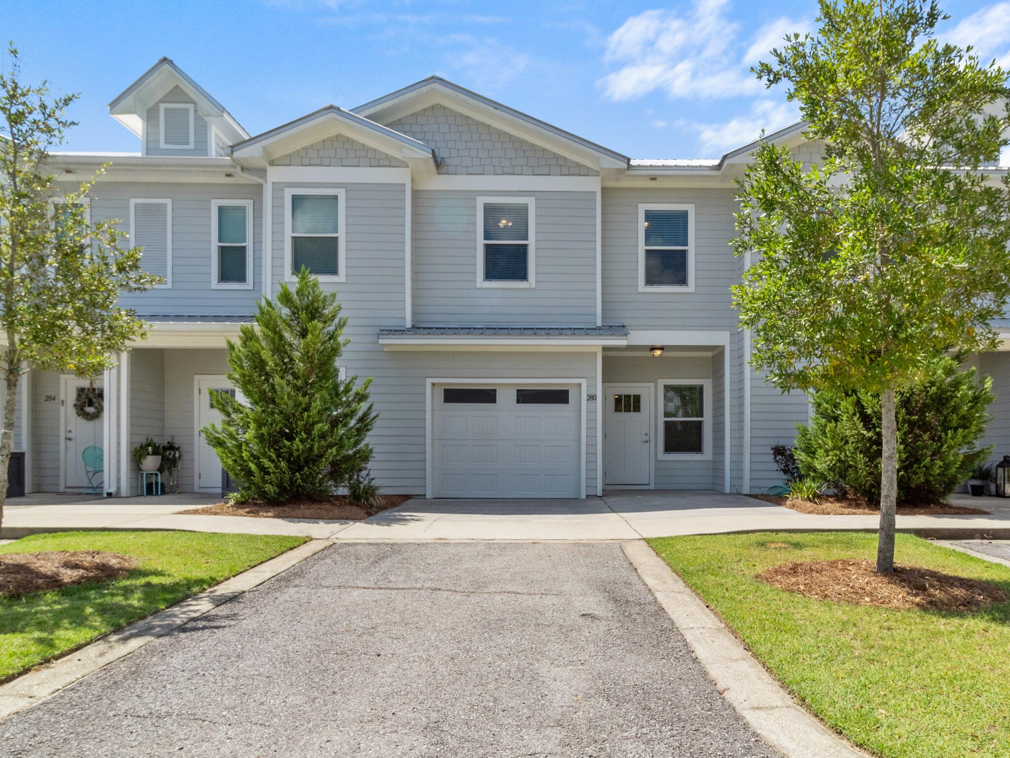 Skip the noise and uncertainty of ongoing construction and settle into the refined comfort awaiting you at 280 Date Palm Lane. Set further back into the community, this luxury townhome offers a peaceful setting while keeping you local to everything Freeport has to offer. Residents enjoy access to the community POOL, playground, basketball, and brand-NEW pickleball courts, creating space for both relaxation and recreation right at home. Inside, the open-concept living area offers a versatile space for gathering or recharging. All bedrooms are located upstairs, allowing for added privacy and a smooth transition from the main living space. This particular unit includes a garage and is positioned next to green space, two features that set it apart. The screened enclosed porch offers a great place to enjoy morning coffee or unwind in the evening while staying shaded and bug-free. Other highlights include double vanities and l-shaped walk-in closet in the primary suite, a pocket door in the downstairs powder room, ceiling fans and lights in each bedroom, architectural trim, faux wood blinds on all windows, and generous storage throughout the home. The washer and dryer are included, and the home is finished with Moen satin nickel fixtures, quartz countertops, LVP floors throughout (no carpet!), and a durable metal roof. Located under half a mile from Freeport Elementary with easy access to both Highway 20 and Highway 331, this property offers everyday convenience in one of Florida's fastest-growing towns. Make sure to ask your agent for a link to the video tour!