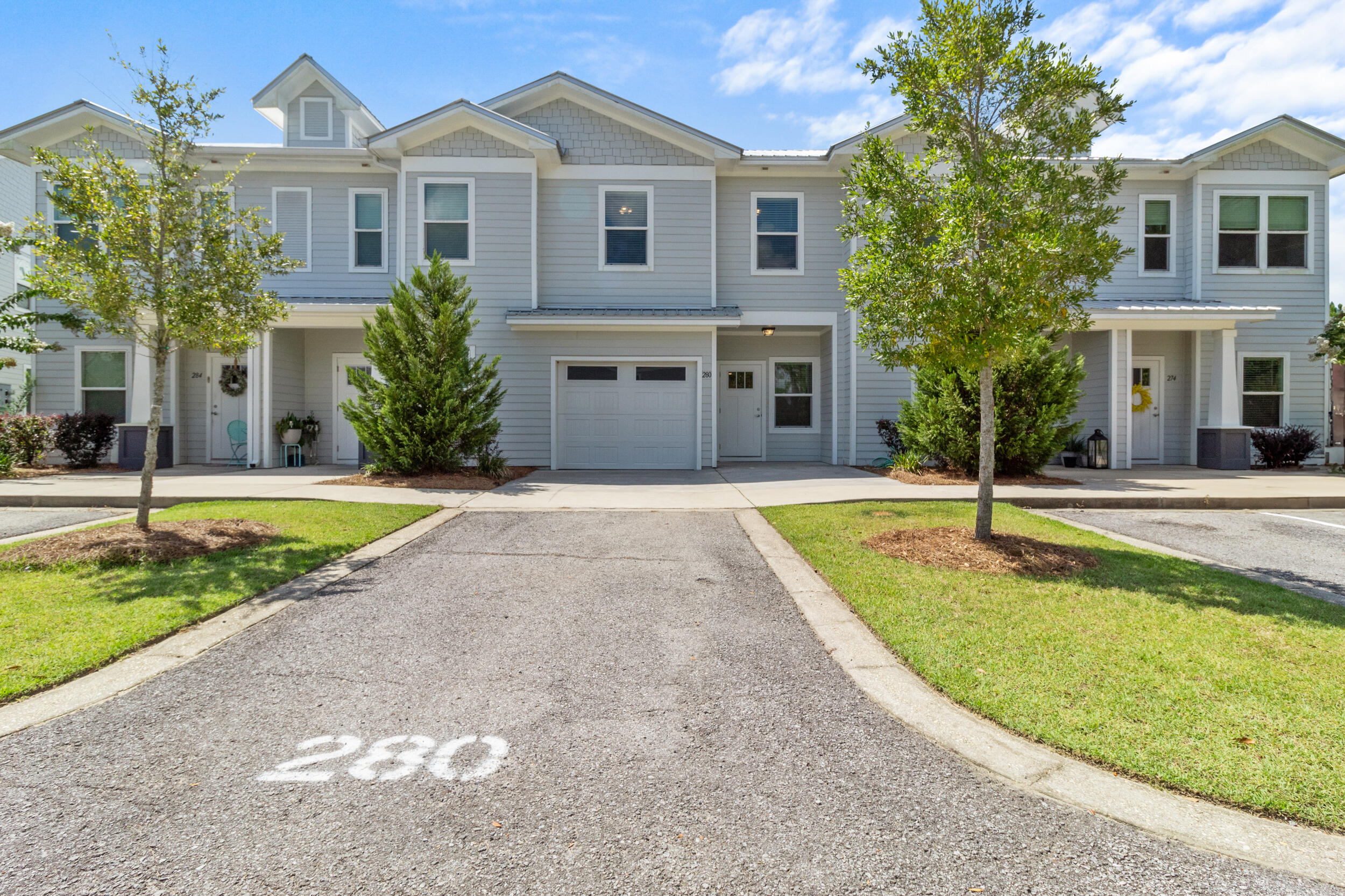 Skip the noise and uncertainty of ongoing construction and settle into the refined comfort awaiting you at 280 Date Palm Lane. Set further back into the community, this luxury townhome offers a peaceful setting while keeping you local to everything Freeport has to offer. Residents enjoy access to the community POOL, playground, basketball, and brand-NEW pickleball courts, creating space for both relaxation and recreation right at home. Inside, the open-concept living area offers a versatile space for gathering or recharging. All bedrooms are located upstairs, allowing for added privacy and a smooth transition from the main living space. This particular unit includes a garage and is positioned next to green space, two features that set it apart. The screened enclosed porch offers a great place to enjoy morning coffee or unwind in the evening while staying shaded and bug-free. Other highlights include double vanities and l-shaped walk-in closet in the primary suite, a pocket door in the downstairs powder room, ceiling fans and lights in each bedroom, architectural trim, faux wood blinds on all windows, and generous storage throughout the home. The washer and dryer are included, and the home is finished with Moen satin nickel fixtures, quartz countertops, LVP floors throughout (no carpet!), and a durable metal roof. Located under half a mile from Freeport Elementary with easy access to both Highway 20 and Highway 331, this property offers everyday convenience in one of Florida's fastest-growing towns. Make sure to ask your agent for a link to the video tour!