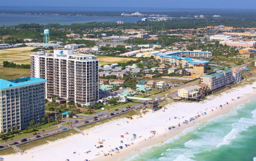 Fully furnished...gulf view!! Own a ground floor one bedroom unit in the popular Destin Surfside for under $190,000. Just walk out to your private walled terrace and take the crossover to the dedicated beach. This home offers large patio area, fully furnished kitchen and neutral frise carpet. New barn doors have been added to the living room, entering the hallway and also on the bathroom. In addition crown molding, new closet doors and a new dishwasher has been added. This is a terrific rental or second home. Surfside offers many amenities- Covered Parking, Meeting Room, Interior Corridors and Elevators, Wake-up Service, High Speed Internet, Heated Pool w/ Hot Tub, Fitness Room, Tennis, Saunas, Basketball, Volleyball, and a Sky bridge to Surfside's deeded beach.