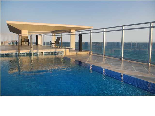 This elegantly furnished Signature Beach residence on the coveted east end offers incredible sweeping gulf and coastline views. The terrace is expansive and beautifully furnished for outdoor living. The foyer opens to the spacious Gulf front kitchen, wet bar and living area with stunning floor-to-ceiling glass windows spanning 54 feet! The grand Gulf front master suite features 10' ceilings and floor-to-ceiling windows with Hunter Douglas Luminnette window treatments that offer privacy with option of allowing light and breathtaking views, or room darkening. The large gulf front master bath features 2 large windows, gulf views, large two person jet tub with marble surround, custom marble floors, water closet with bidet, spacious shower with full body jets, vanity to ceiling mirrors, and