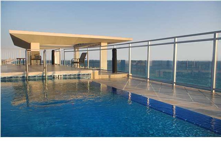 This elegantly furnished Signature Beach residence on the coveted east end offers incredible sweeping gulf and coastline views. The terrace is expansive and beautifully furnished for outdoor living. The foyer opens to the spacious Gulf front kitchen, wet bar and living area with stunning floor-to-ceiling glass windows spanning 54 feet! The grand Gulf front master suite features 10' ceilings and floor-to-ceiling windows with Hunter Douglas Luminnette window treatments that offer privacy with option of allowing light and breathtaking views, or room darkening. The large gulf front master bath features 2 large windows, gulf views, large two person jet tub with marble surround, custom marble floors, water closet with bidet, spacious shower with full body jets, vanity to ceiling mirrors, and