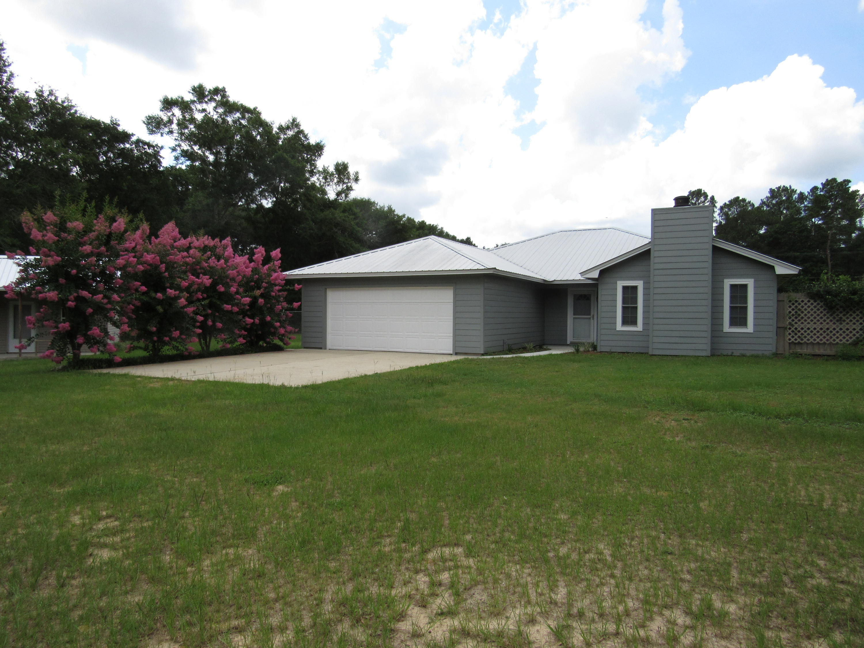 Renovated home situated on 2.29 acres. This home is in a great location for those wanting the North side of town for easy access to Crestview, High School, Davidson Middle School shopping, eateries, entertainment and churches. This property features a rear entry garage with a electronic gate already in place. The rear 2 acres is fenced with a 6'chain link fence. The home has a unique floor plan with 2 living areas. The family room has a fireplace and windows to look out over the rear yard and all the established plants. The eat in kitchen is spacious and inviting. The master bath features a spacious walk in closet. The master bath has a new tiled shower. Outside you'll find the exterior upgraded with hardi board siding. New flooring to include carpet, engineered wood, and ceramic tile.