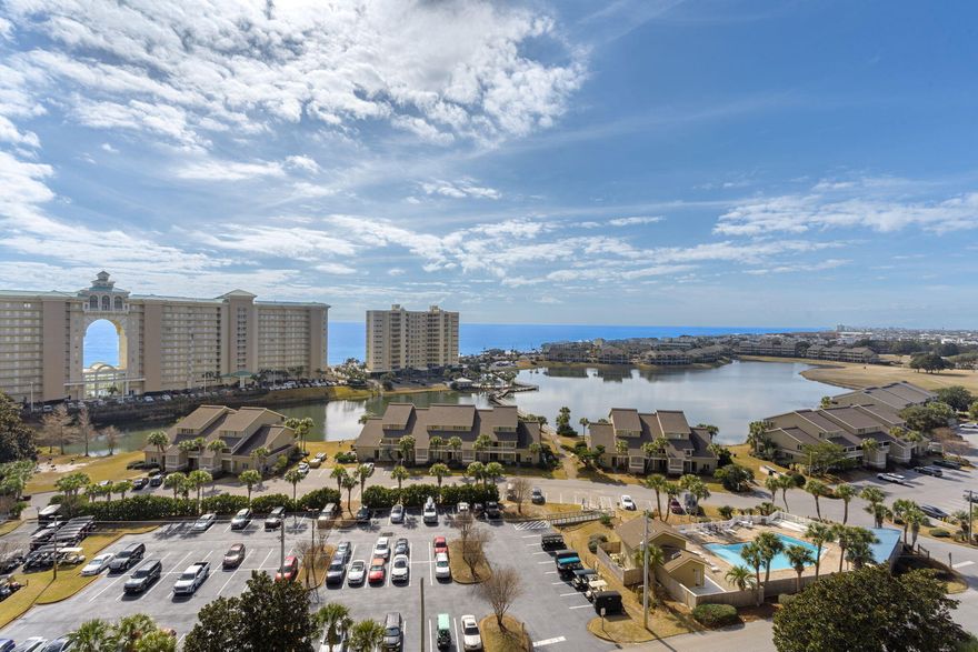 Located on the 11th floor of Ariel Dunes II, this beautifully appointed condominium offers spectacular panoramic views of the Gulf of Mexico and miles of coastline. Enjoy the scenery from the spacious private balcony, perfect for relaxing or entertaining. This turn-key unit is offered furnished in a coastal chic style and features a kitchen with granite countertops, solid wood cabinetry, and a breakfast bar. Additional highlights include built-in hallway bunk beds, a stackable washer and dryer, and 9-foot ceilings. Ariel Dunes II offers three expansive resort-style pools totaling nearly 9,000 square feet. Situated within the highly desirable Seascape Resort, owners and guests enjoy access to golf, pickleball, tennis, and approximately 2,000 feet of beach frontage.