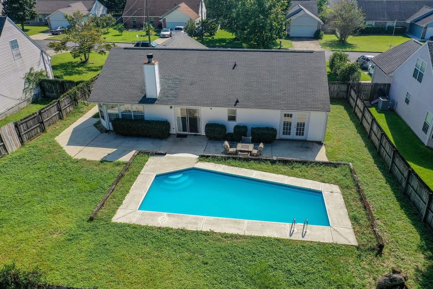 **Be sure to check out the 3-D Virtual Tour**What an amazing opportunity to own a home on a large lot, on the south side of town in a stellar location. This 3 bedroom, 2 bath home features an amazing in-ground pool to cool off on those hot summer days, and a fully fenced backyard, and a new roof to be installed prior to closing. As you enter this property you are greeted with vaulted ceilings, and a stone fireplace as your focal point in the large living area. From this room you can flow directly into the oversized eat in kitchen with an abundance of natural light and airy tones throughout. Take a stroll down the hallway where you will find 3 bedrooms, with the primary bedroom offering an en-suite with double vanities, and a walk-in closet. (click more)