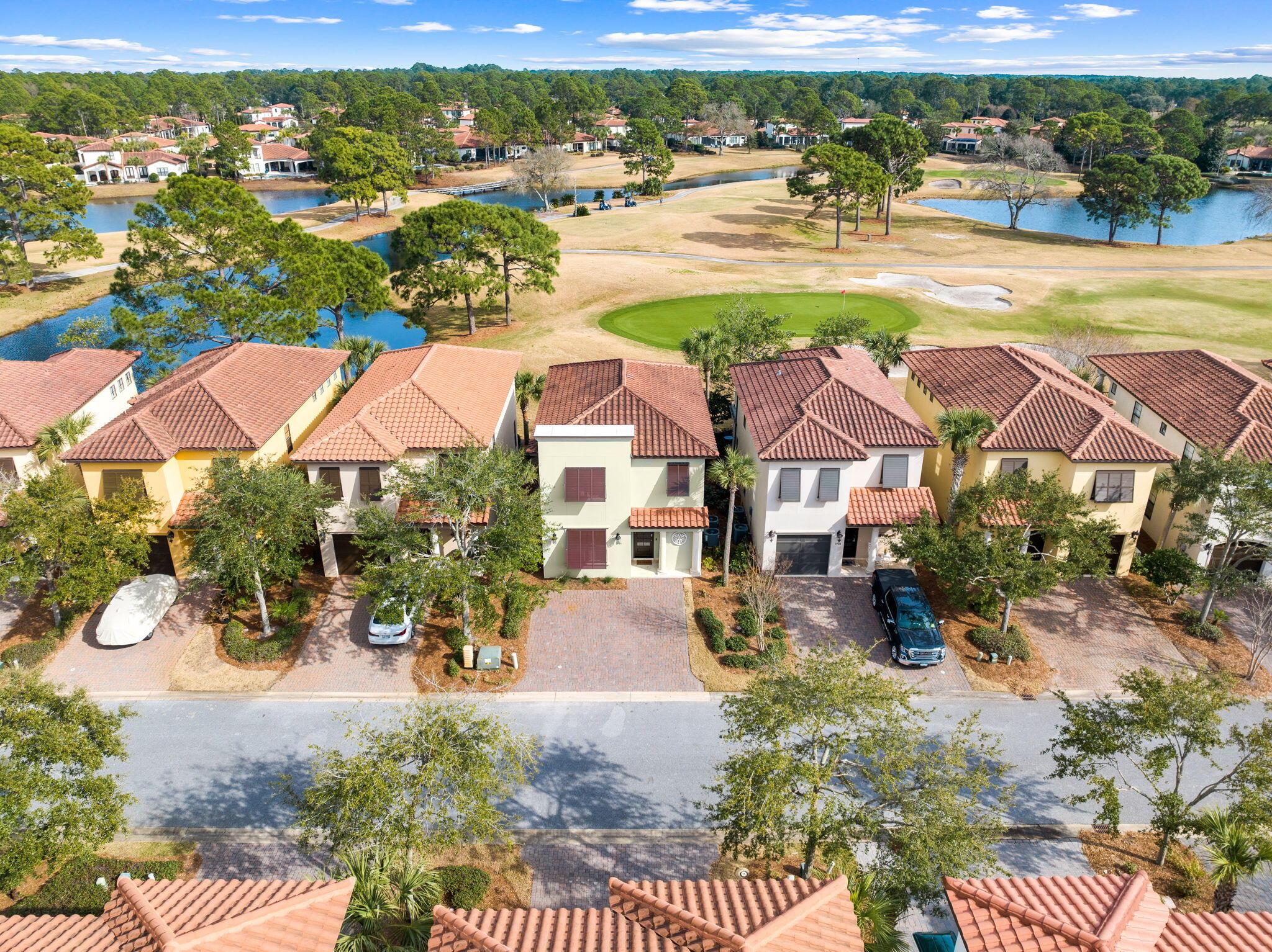 Welcome to a stunning Mediterranean retreat on the Baytowne golf course. This meticulously refreshed home, boasting updates from 2022 to 2024, offers a blend of modern elegance and timeless charm. Step inside to discover new Quartz countertops, freshly painted interiors and exteriors, elegant plantation shutters, polished stone floors, and impressive soaring ceilings.The main level boasts a rare find - a primary suite with two walk-in closets Outside, new Bahamian shutters adorn the front of the home and a spacious attached storage provides the perfect place to stow away bikes and beach chairs, keeping the sand at bay. Villa Lago, a community cherished by both full-time residents and second home owners, also offers the flexibility of short-term rentals
