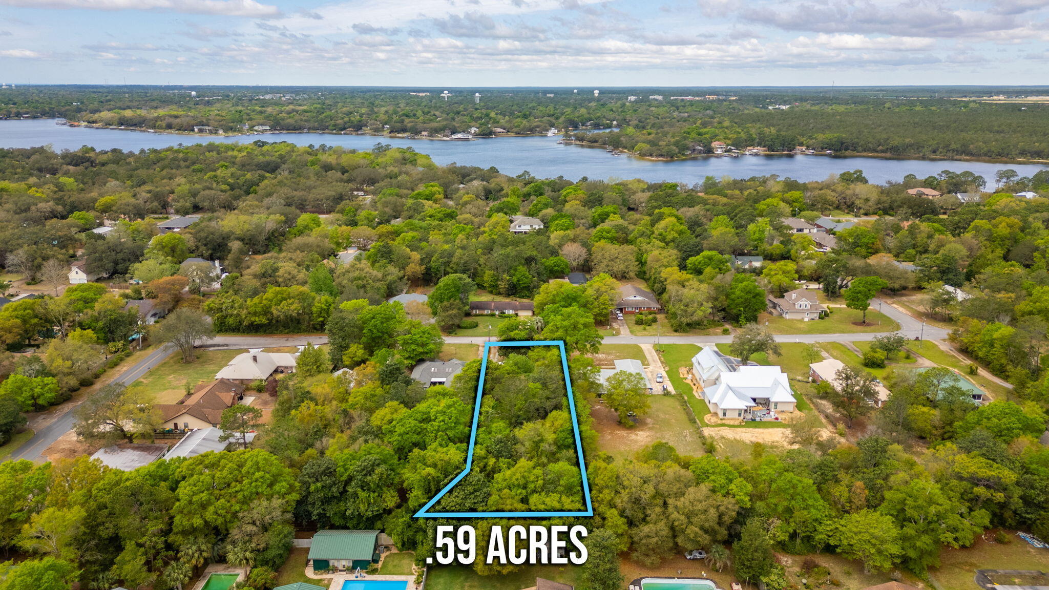 This .59 acre parcel is located in the highly sought after Poquito Bayou neighborhood just a block from the water. This large parcel can be subdivided into two separate lots per the county. The parcels cannot be split prior to sale. There is currently a small home and structure on the property to which no value has been given. This is an occupied property. Please do not walk the lot without an appointment.