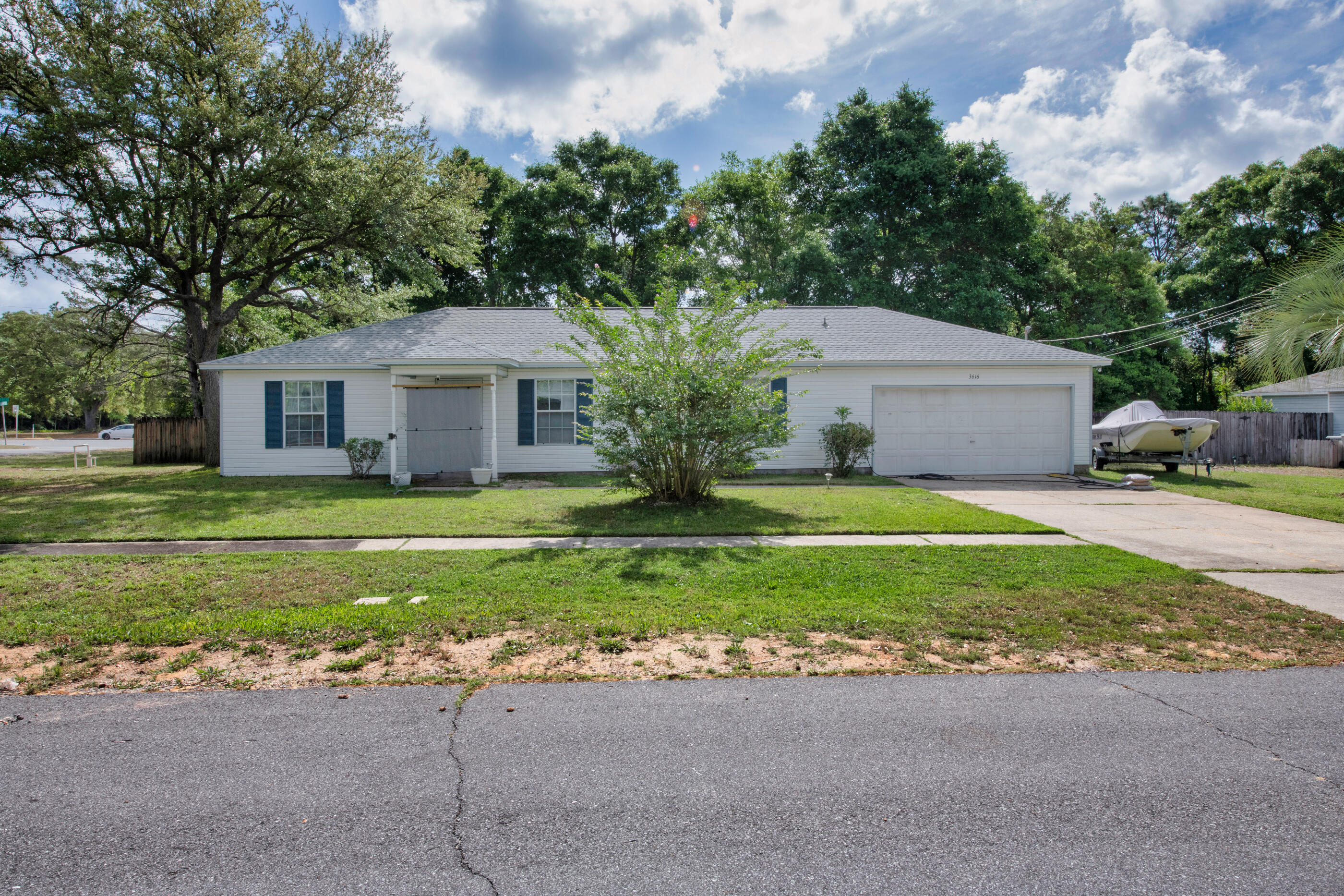 Looking for a cozy homestead vibe without the acreage upkeep? Welcome to this adorable and affordable home tucked just off Hwy 87 in Holley Navarre. Sitting pretty on a spacious corner lot with mature trees providing privacy, this home offers the perfect blend of comfort, function, and value. Before you even step in side you're greeted with a Bird Creek water feature, with water lilies, water hyacinth and continuous flowing water which mosquitoes hate but birds love! Step inside and you'll find a cozy yet surprisingly spacious split floorplan with loads of natural light and NO CARPET! Move right in to this floorplan that features a roomy dining area separate from the kitchen perfect for entertaining. Speaking of the kitchen, it's decked out with new appliances. Do you have a lot of tools and toys? Don't worry, there's a
generously sized 2-car garage perfect for your vehicle, a workshop or storage! The roof was replaced in 2023 giving you peace of mind when it comes to insurance.
The neighborhood features sidewalks, and is just minutes from Navarre's popular restaurants (like Ye Old Brothers), shops, and only 15 minutes to the white sands of Navarre Beach. Looking for more outdoor fun, the home is only 50 yards to the south border of the Eglin Reservation where there are lots of outdoor recreation options (permitted needed).
The screened-in back patio overlooking the backyard is perfect for morning coffee, evening wine or hosting a get together with friends. Whether you're dreaming of chickens, raised garden beds, or just space to breathe, this property gives you that homestead feel without the hassle of managing acreage. There are already fig trees, grapes, gooseberries bushes and kiwis growing, as well as lettuce, squash tomatoes, peas, carrots and more. There are wild greens growing near the chicken coop for a free little treat for your feathered friends. A deep well pump was installed a few years ago to keep those fruits and vegetables growing with the automatic sprinkler system! All under $350K? Yep, it's a rare find!