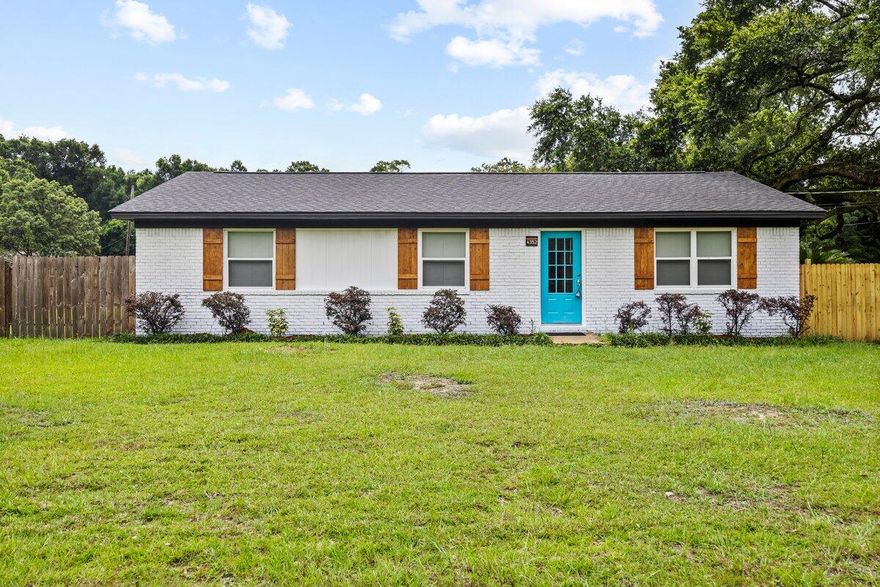 Welcome to this beautifully renovated ranch-style home situated on a large corner lot with a fully fenced backyard--perfect for entertaining, playing with pets, and even a future pool! This 3-bedroom, 2-bath gem has been thoughtfully updated from top to bottom and is ready for you to move right in. Step inside to discover brand new flooring throughout, fresh paint, and stylish new fixtures and ceiling fans in every room. The updated kitchen features open shelving, classic shaker-style cabinets, sleek stainless steel appliances, and plenty of counter space for cooking and entertaining. The adjacent oversized laundry room offers extra storage with built-in cabinetry for convenience and organization. Both bathrooms have been upgraded with modern vanities, new mirrors, tiled floors, and beautifully tiled tub surrounds, giving each space a clean, fresh look. Outside, enjoy the shade of a mature oak tree in your backyard while relaxing on the covered back porch, or pick fresh fruit from the pear tree in your front yard. The expansive yard has room to park your boat or RV. No HOA here! Roof 2025, Water Heater 2023.