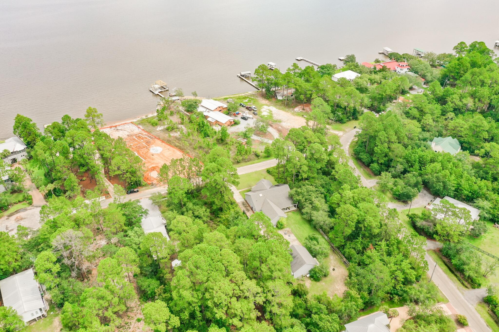 Amazing lot, second tier from the Bay. Located in the very quiet neighborhood of Bay Pine Shores. The trees on the property are large and beautiful. Quick access to 331 and 98 for all the shopping, restaurants and our fabulous beach. With just over a 1/2 acre, it is ready for somebodies dream home.