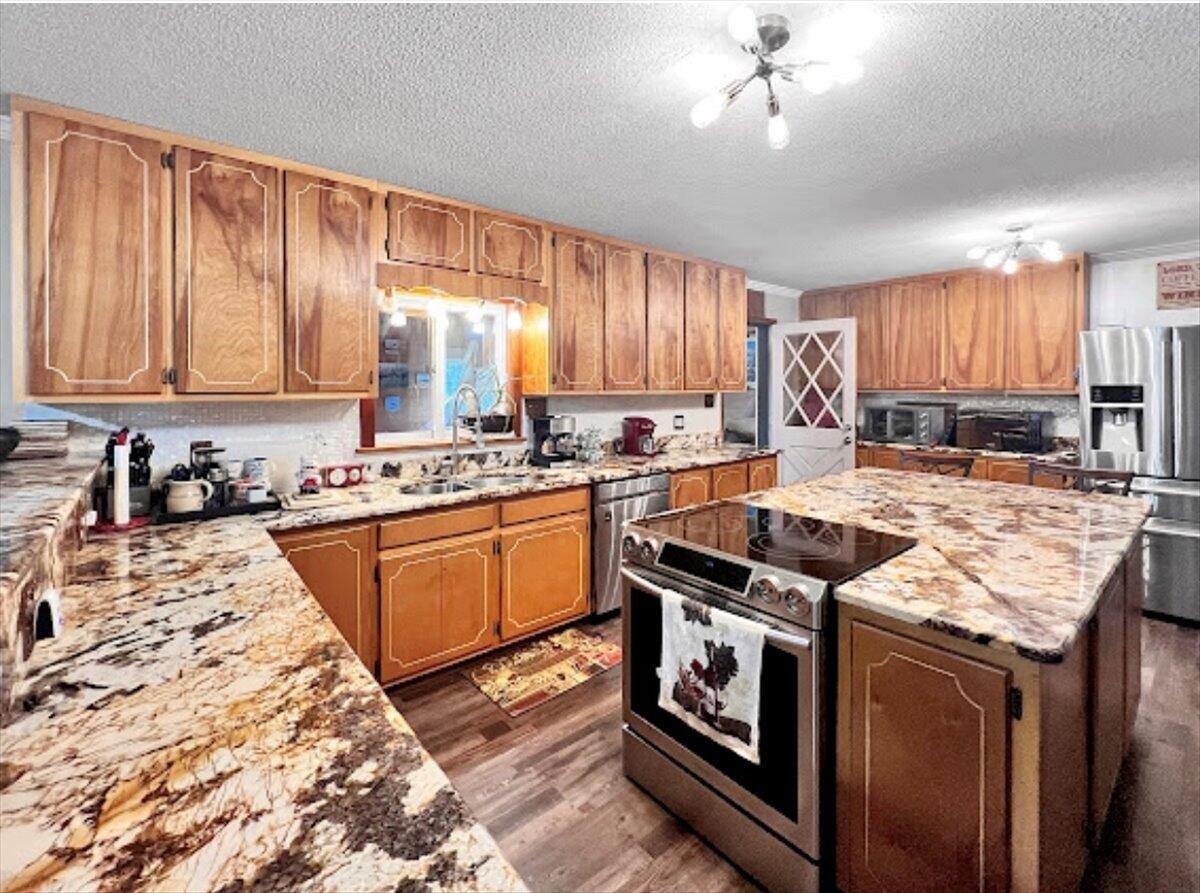 MASSIVE PRICE REDUCTION! Sellers are motivated! Come take a look at the potential of this incredibly unique home before it's gone! Check out this truly unique CUSTOM-BUILT gorgeous home on 4.58 ACRES! This AMAZING home would be a fantastic primary residence or charming Air BNB/bed and breakfast! The possibilities are endless! This property has a total of 4 levels, including the BASEMENT...yes, you heard that right, a Florida home with a BASEMENT! And yes, the walk-out basement has a FULL BAR for entertaining and a secret room behind a phone booth that's a SPEAK EASY, which could be converted into another bedroom! This is one of the most unique homes I've ever been in and is FULL of potential. A new metal roof was put on in 2018!