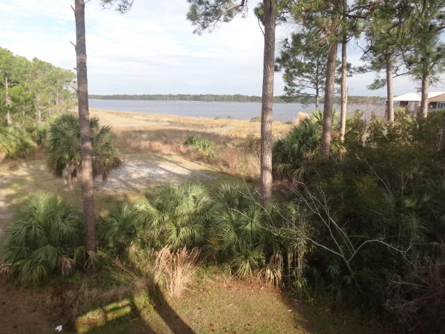 Perfect starter-home; or, an easy place to 'slip away to'. Conveniently located on the Easy End of Panama City Beach, this condo offers terrific views of Lake Powell, covered parking as a top-floor unit. Pirates Cove has two pools, dock and private boat ramp on Lake Powell. Seller is Licensed Florida Real Estate Broker. ***Buyer is responsible for personally verifying details about this property. Any information contained in this listing is believed to be accurate but is not guaranteed.***