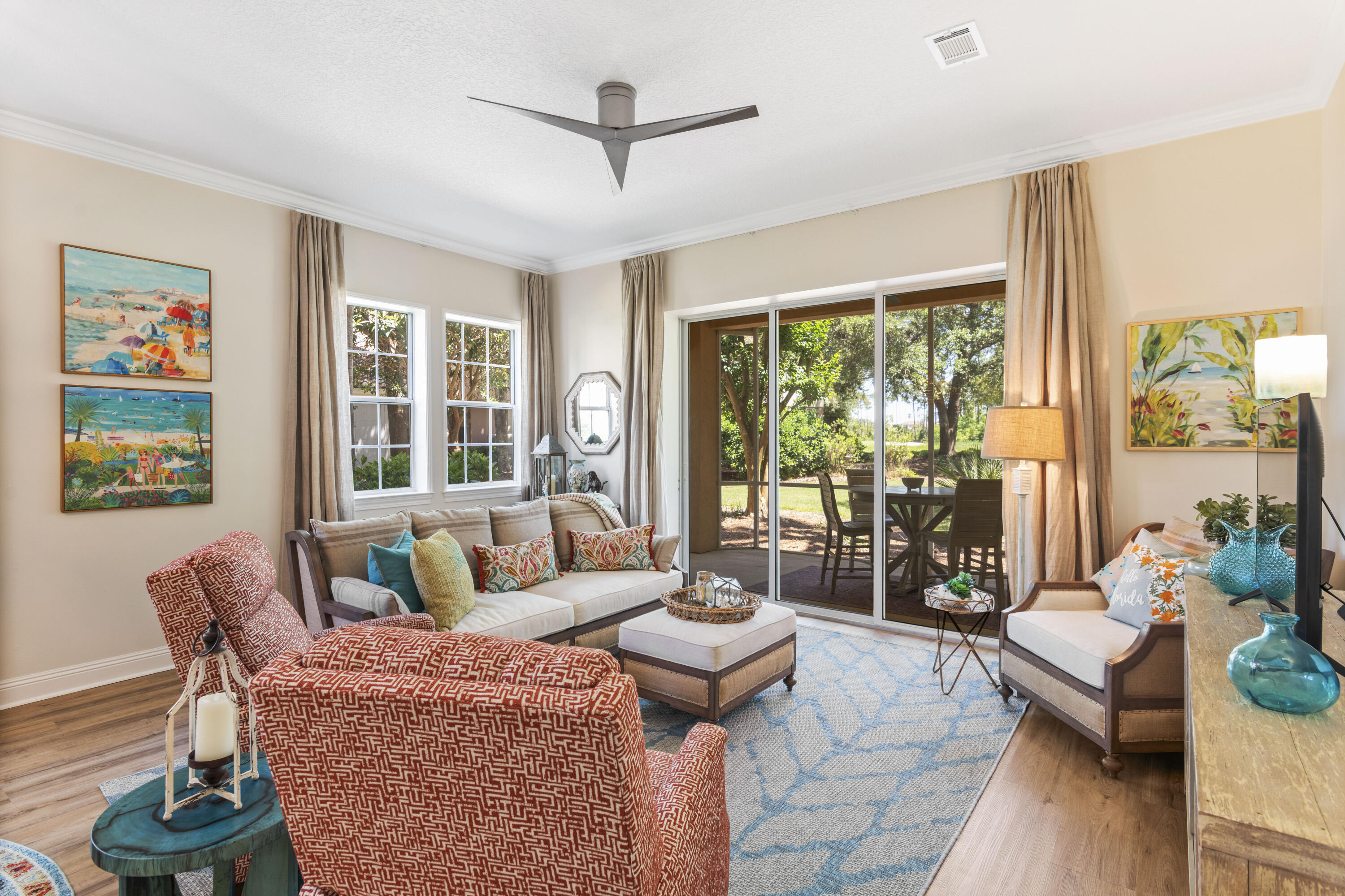 Desirable ground-floor Golf Villa unit nestled within the prestigious Regatta Bay Development, ideally positioned along the third tee of Destin's premier golf course, promising daily enjoyment. This meticulously renovated 2195 square foot residence, smartly acquired in 2021, underwent a comprehensive transformation, boasting a contemporary aesthetic throughout. Fashionably painted in Sherwin Williams Oyster White, complementing the beach blonde luxury vinyl tile flooring and custom drapery in every room.The sunlit living-dining area seamlessly flows into the brand-new (2024) screened Lanai, expanding the living space with triple sliding doors. The adjacent contemporary designer kitchen features custom-made cabinets, exquisite Cambria Kelvingrove Quartz countertops, and