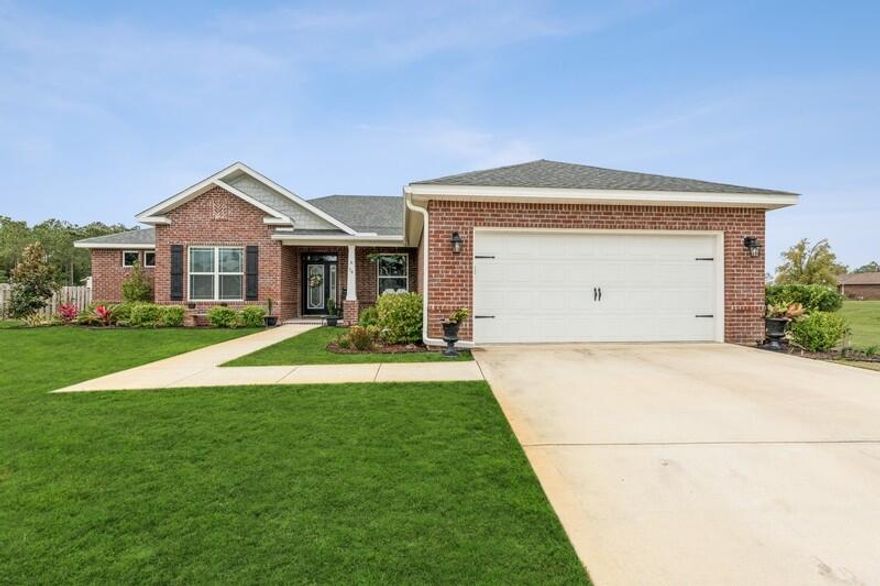 Welcome to Brighton at Hammock Bay! This immaculate one-of-a kind all brick 4 bedroom, 3 bathroom home boasts a split floor plan and open concept that buyers have come to expect with an additional $54k in builder upgrades. As you enter the long foyer, you will find a spacious home office with glass doors located to your left and a formal dining room w/ tray ceiling and crown molding to your right. Moving forward, you will enter the spacious living room with a custom grid beamed tray ceiling with crown molding. Just off the living room, you will find the large kitchen with granite, tile back splash, all stainless steel appliances, gas range, double oven, island breakfast bar, pantry and butler's pantry to name a few... The 2nd dining area is just off the kitchen for your day to day meals.