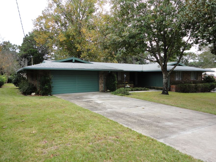 SHALIMAR near EGLIN AFB in desirable Poquito Bayou. Location, location, location! This classic brick ranch home with 4-bedrooms and 2 full baths lives larger than the square footage. As you enter, there is a beautiful tiled foyer leading to a large living room and a formal dining room, both recently tiled with 20'' gorgeous tile. The spacious family room has a fireplace. The roomy kitchen has classic wood cabinets and a breakfast bar. You'll love the Sunny Florida room off the family room and the large fenced back yard with a good sized outbuilding. Over sized two car garage plus a large laundry room for extra storage. The wiring has all been changed out to copper wire, for safety and lower insurance bills. All of the appliances convey as well.